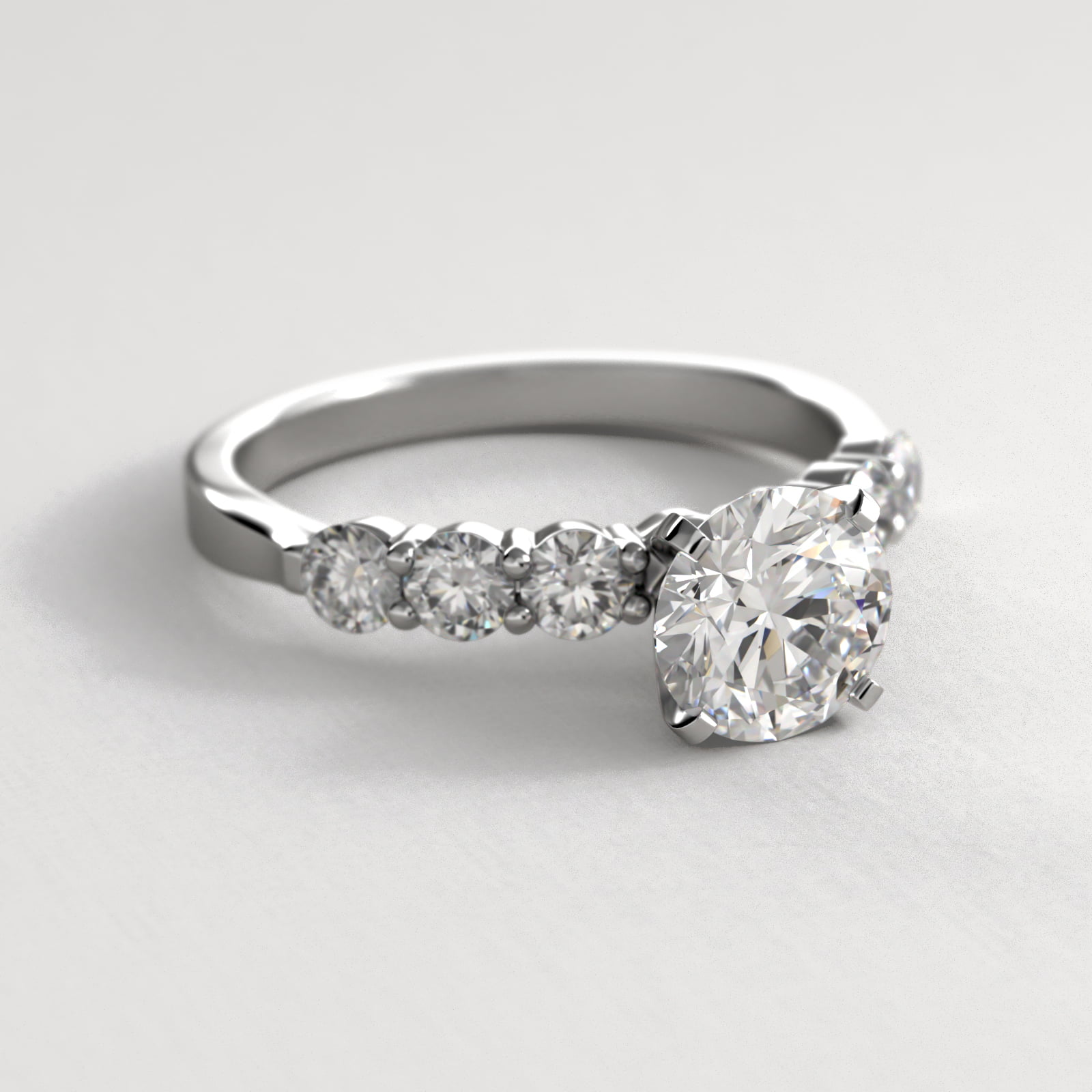 Six Round Side Stone Diamond Common Prong Engagement Ring In Platinum