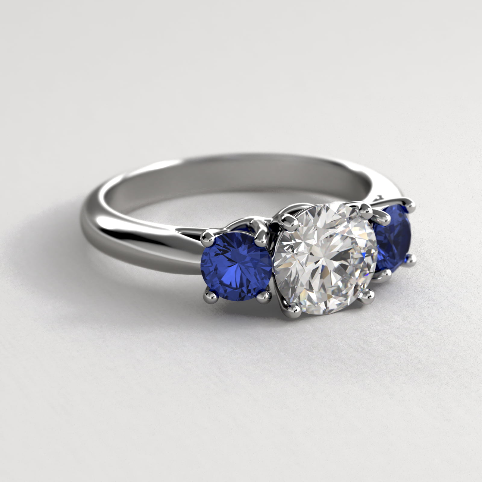 Round Blue Sapphire Three Stone Engagement Ring In 14K White Gold
