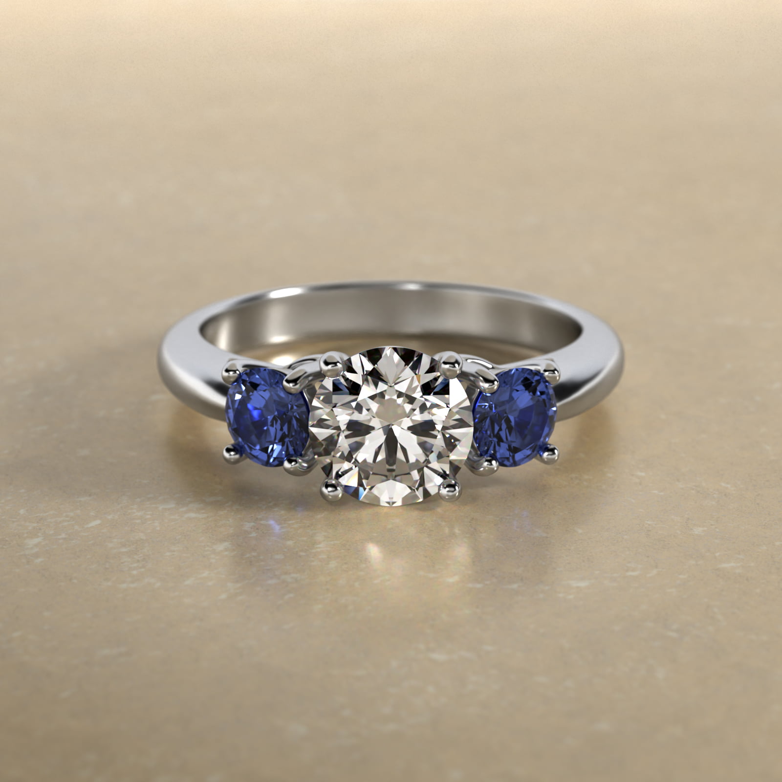 Round Blue Sapphire Three Stone Engagement Ring In Platinum
