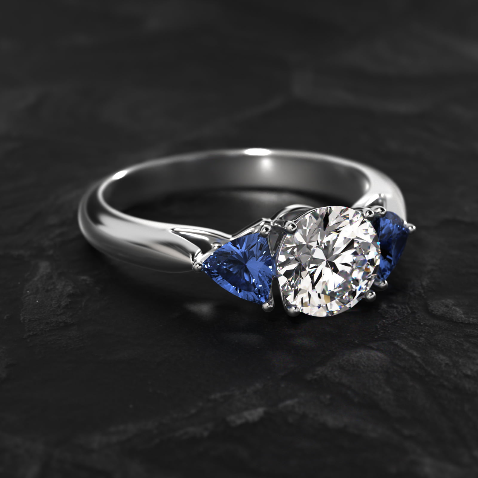 Trillion Cut Blue Sapphire Three Stone Engagement Ring In Platinum
