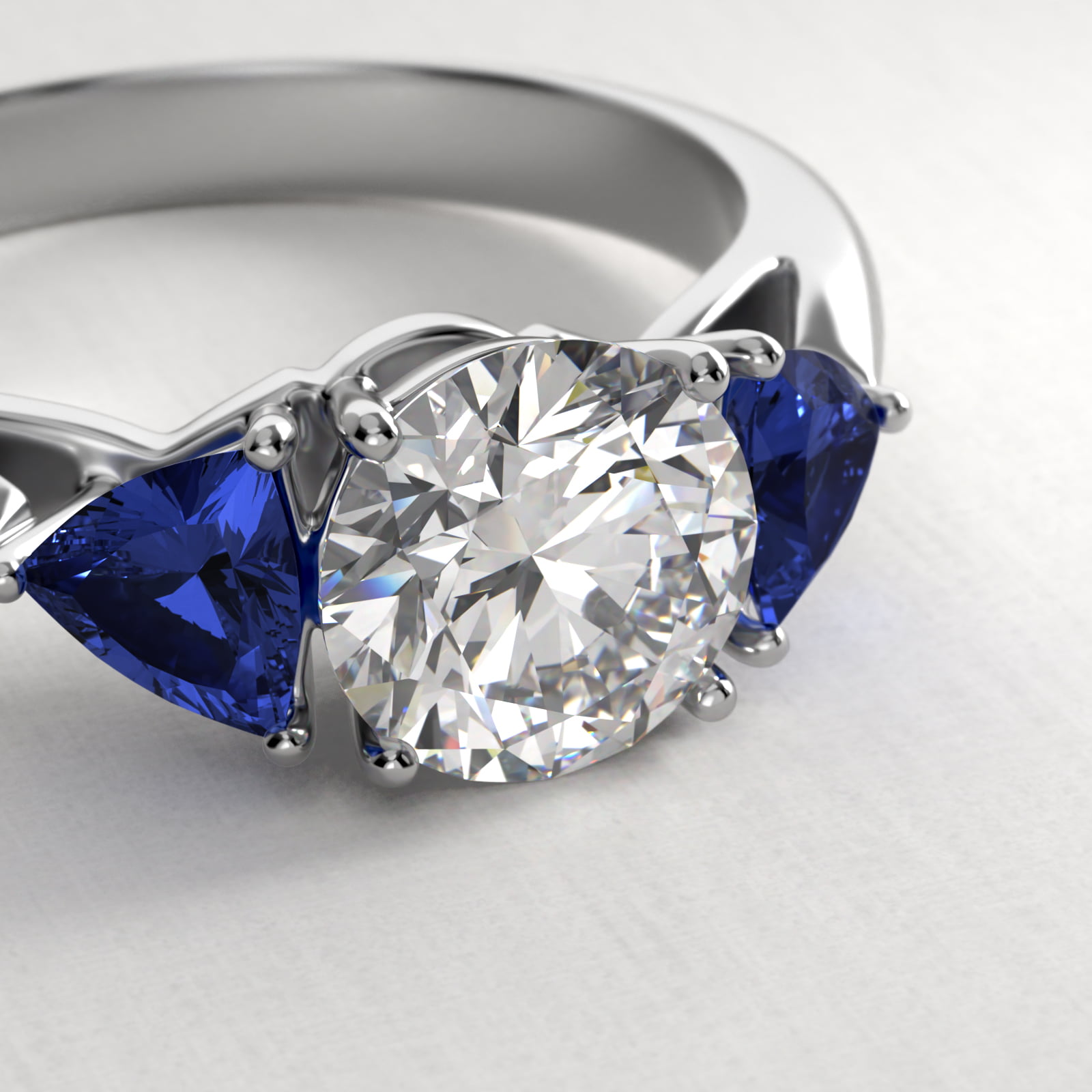 Trillion Cut Blue Sapphire Three Stone Engagement Ring In 18K White Gold