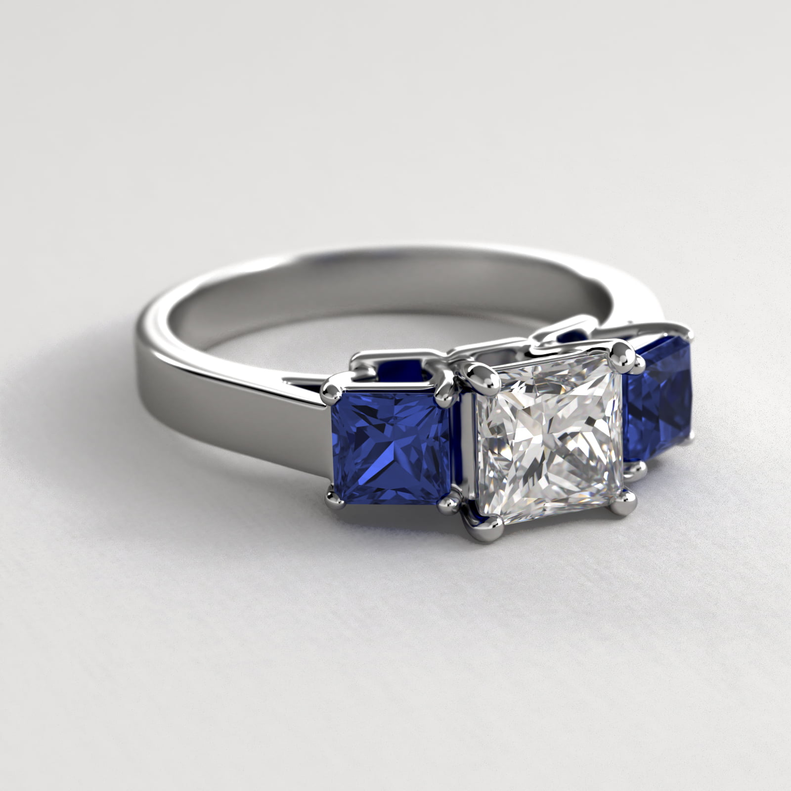 Princess Cut Blue Sapphire Three Stone Engagement Ring In 18K White Gold