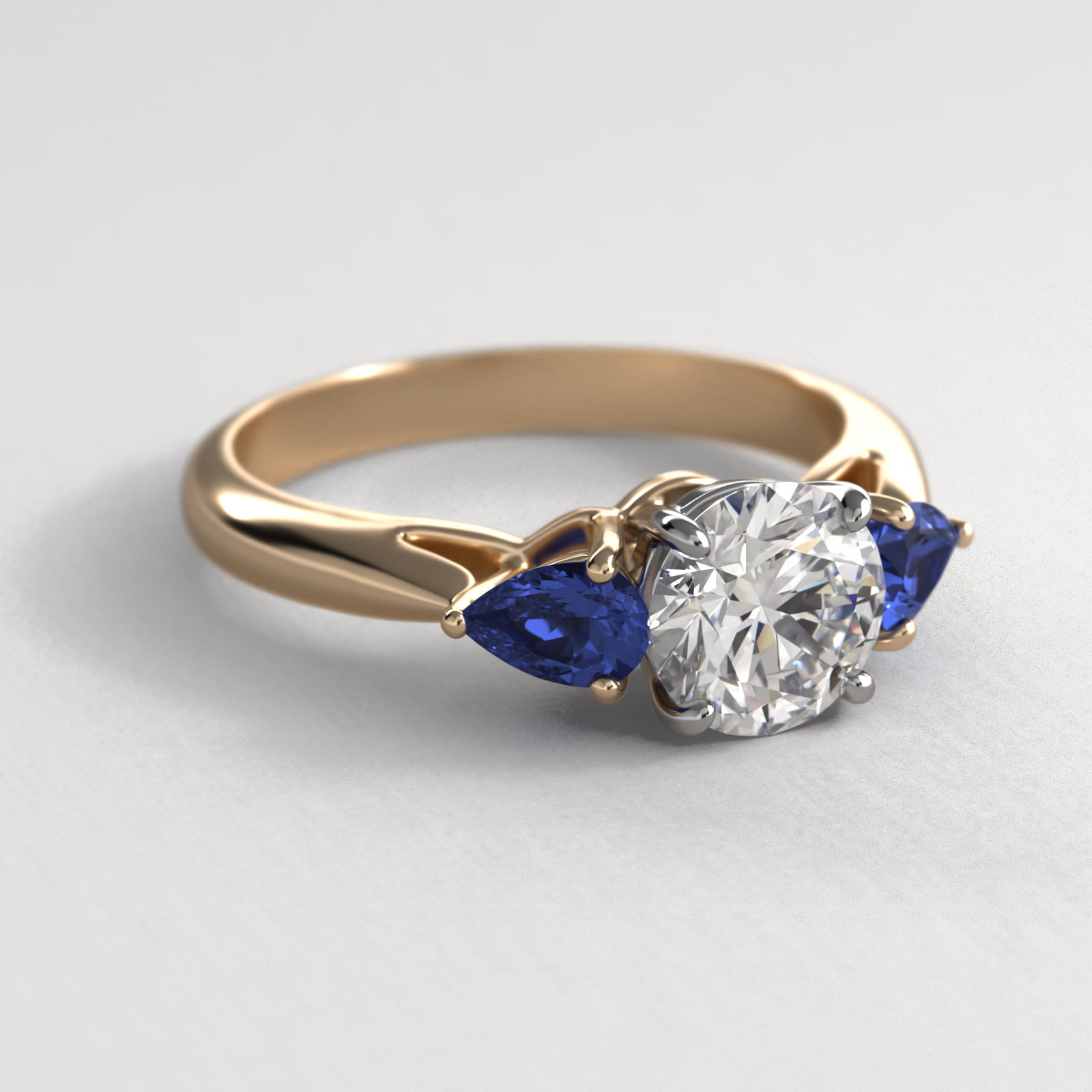 Pear Shaped Blue Sapphire Three Stone Engagement Ring In 14K Yellow Gold