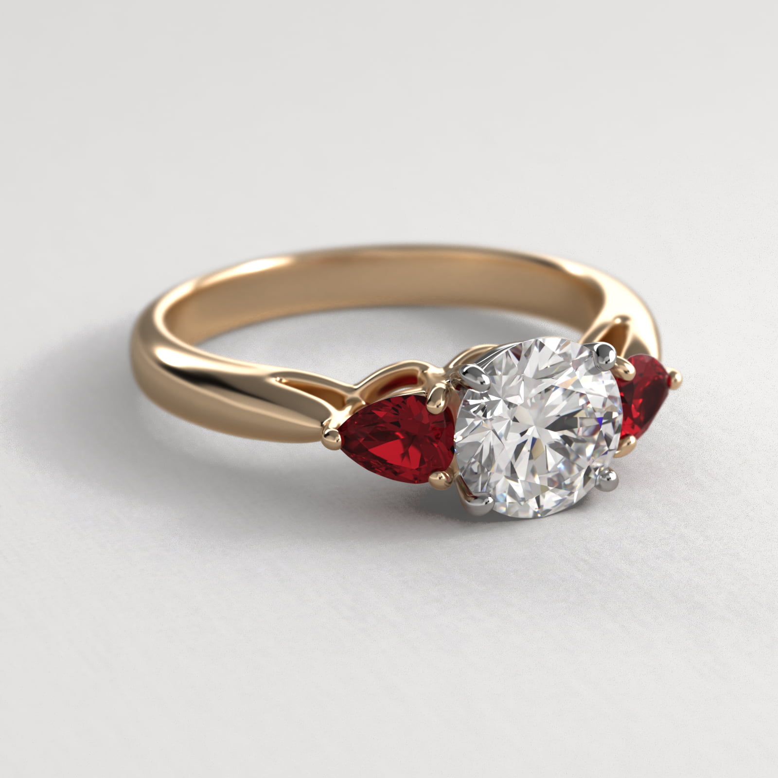 Pear Shaped Ruby Three Stone Engagement Ring In 18K Yellow Gold