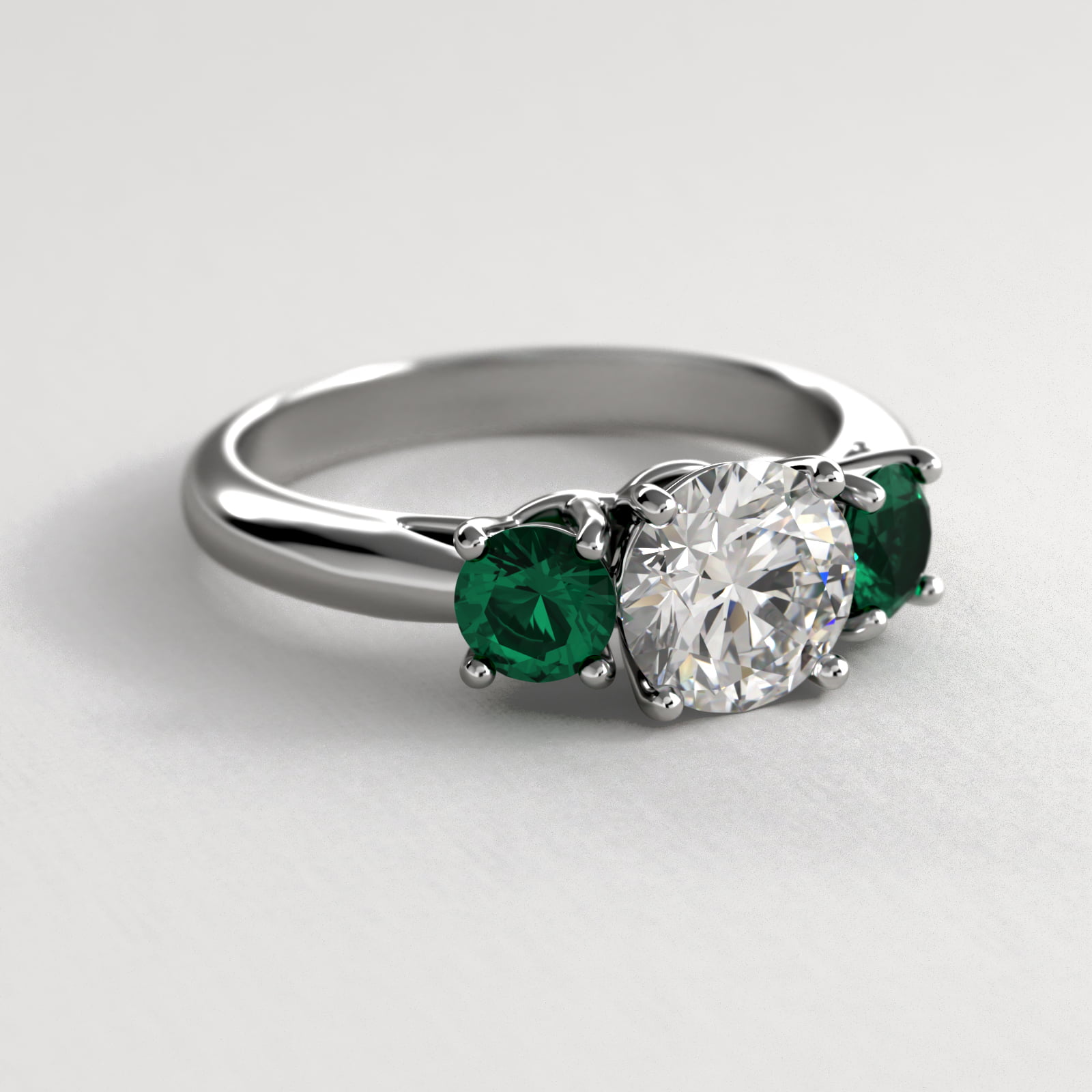 Round Emerald Three Stone Engagement Ring In 18K White Gold