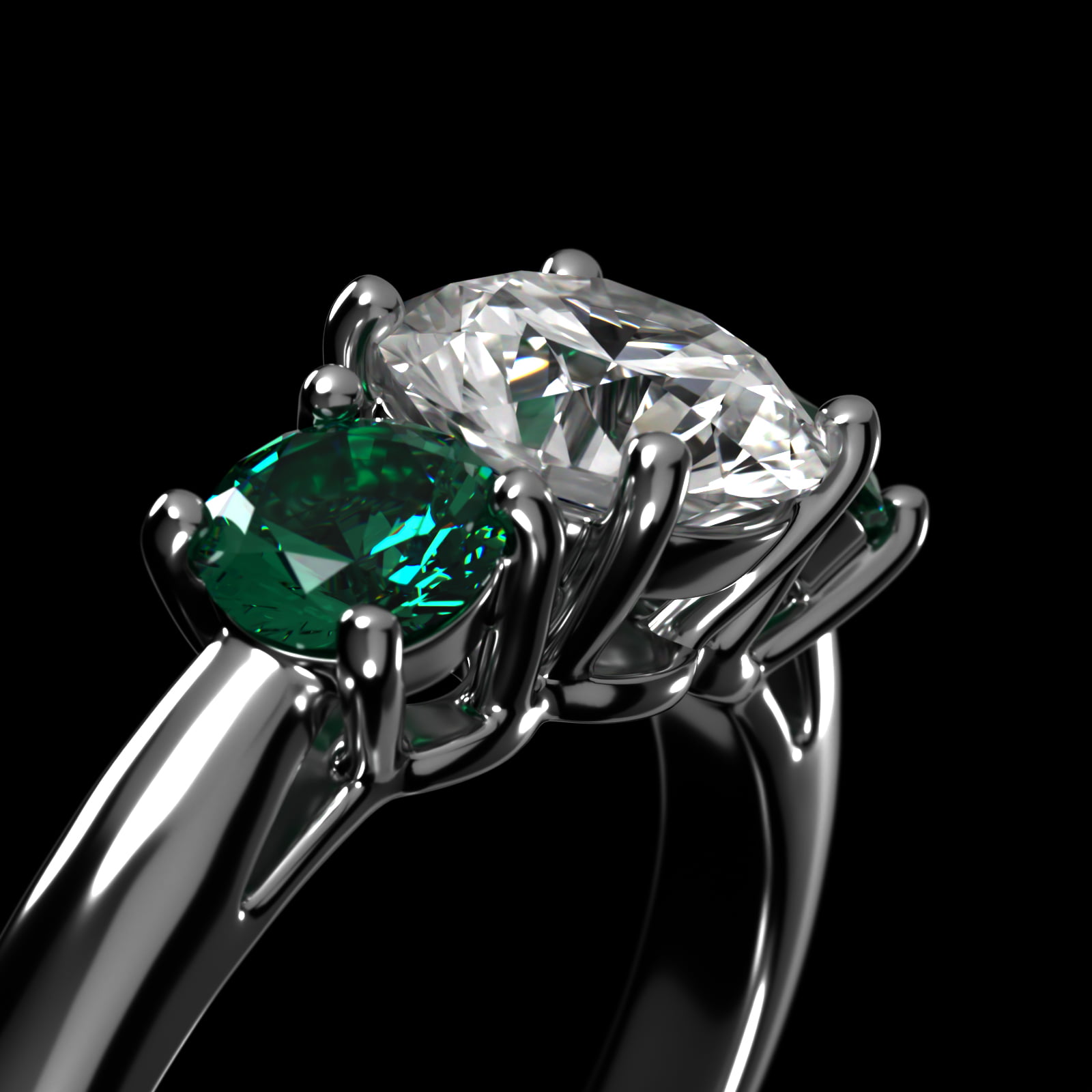 Round Emerald Three Stone Engagement Ring In Platinum