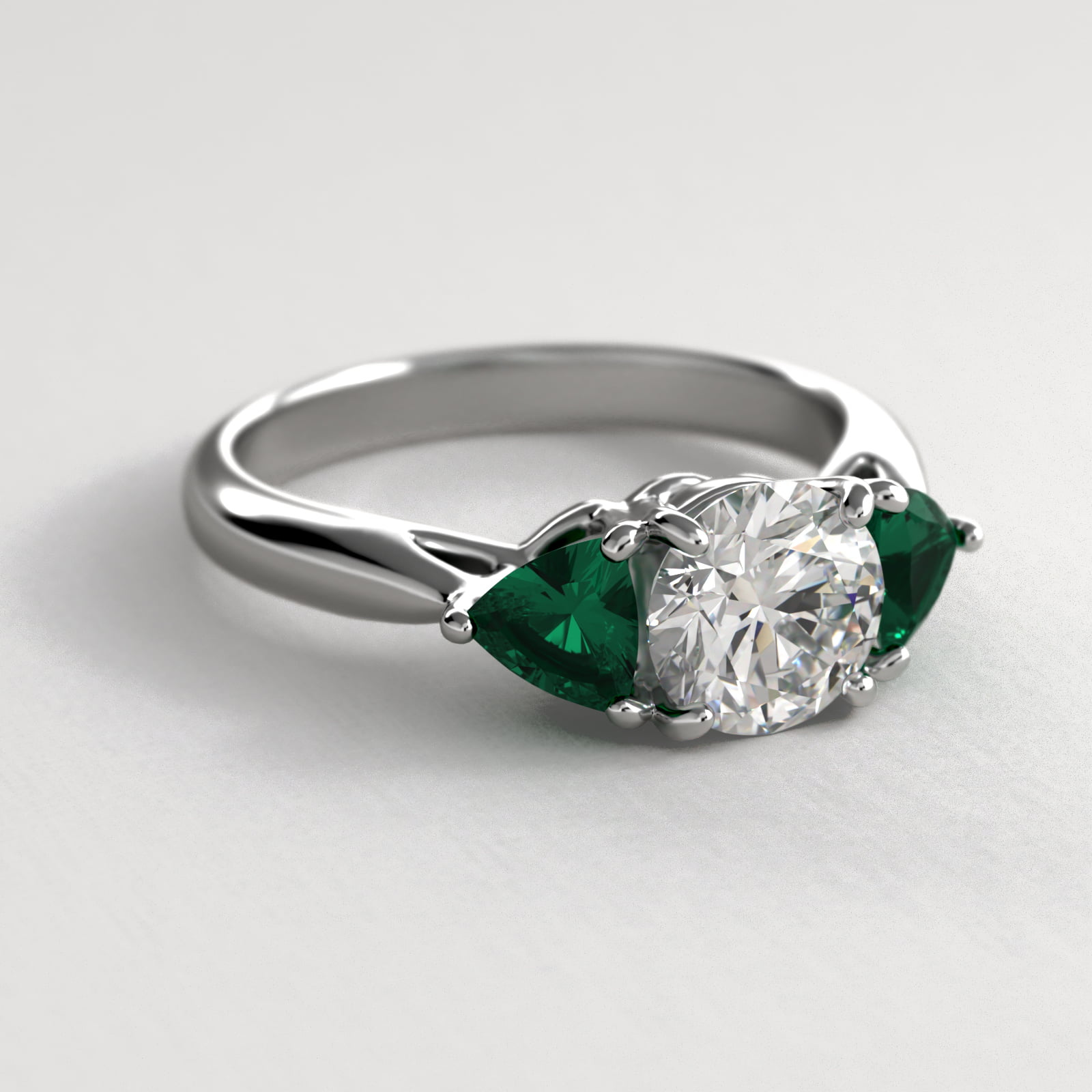 Trillion Cut Emerald Three Stone Engagement Ring In Platinum