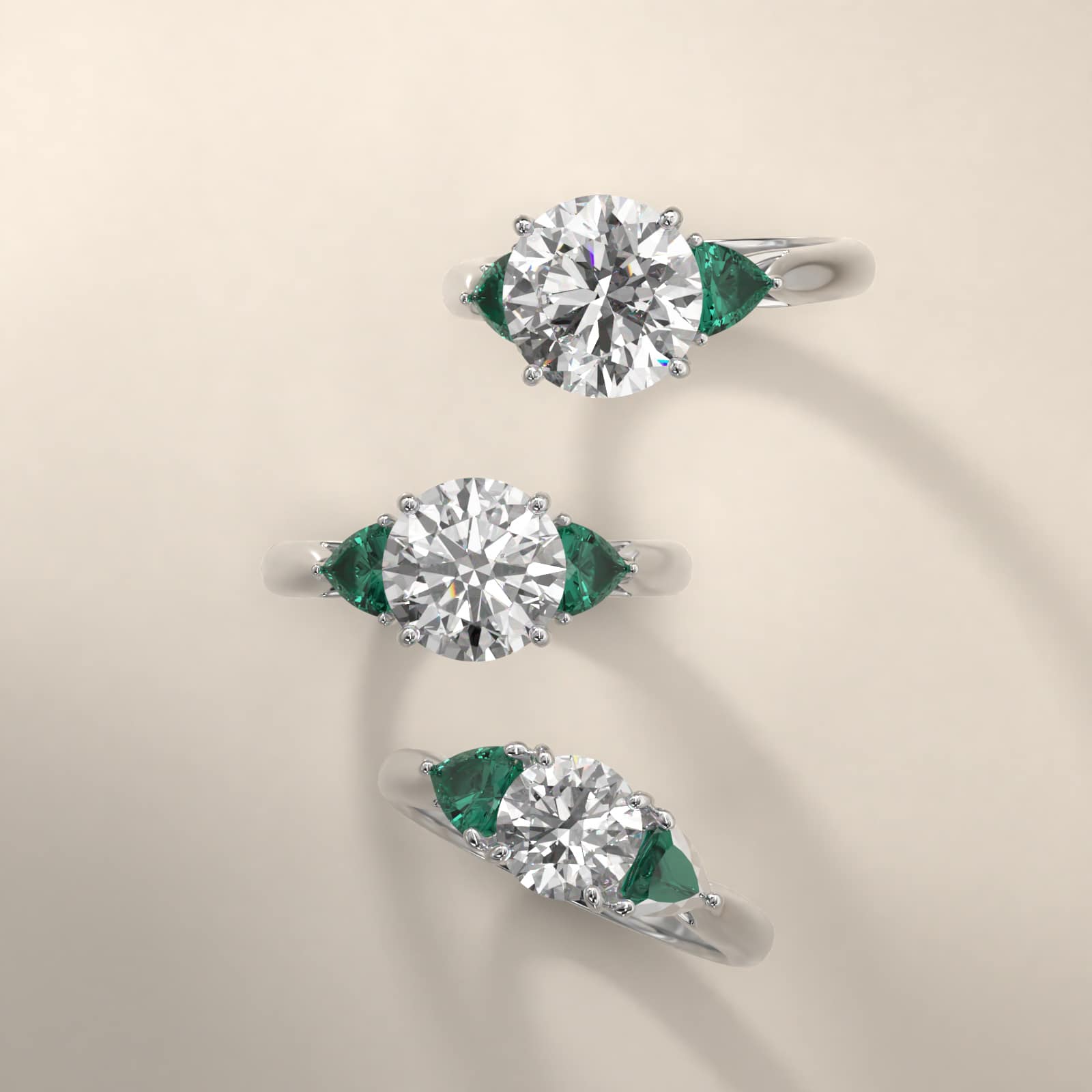 Trillion Cut Emerald Three Stone Engagement Ring In Platinum