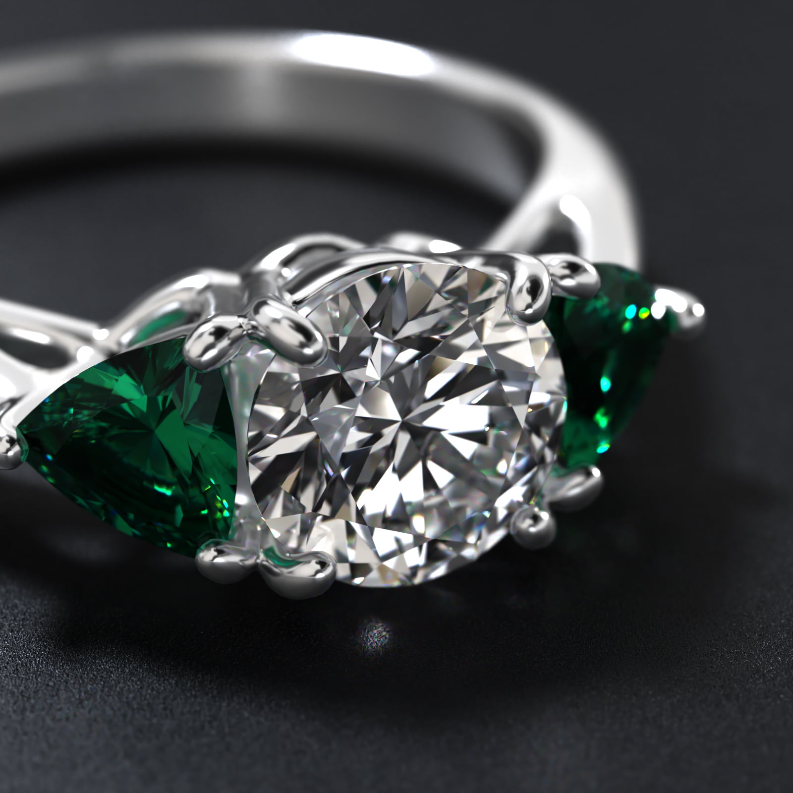 Trillion Cut Emerald Three Stone Engagement Ring In Platinum