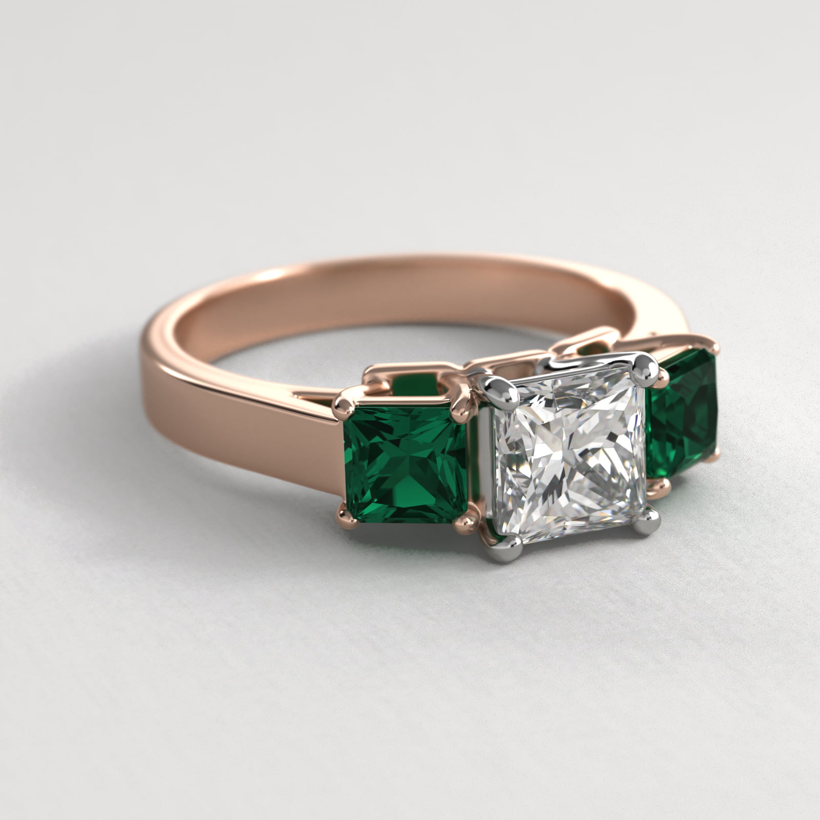 Step-Cut Emerald Three Stone Engagement Ring In 14K Rose Gold