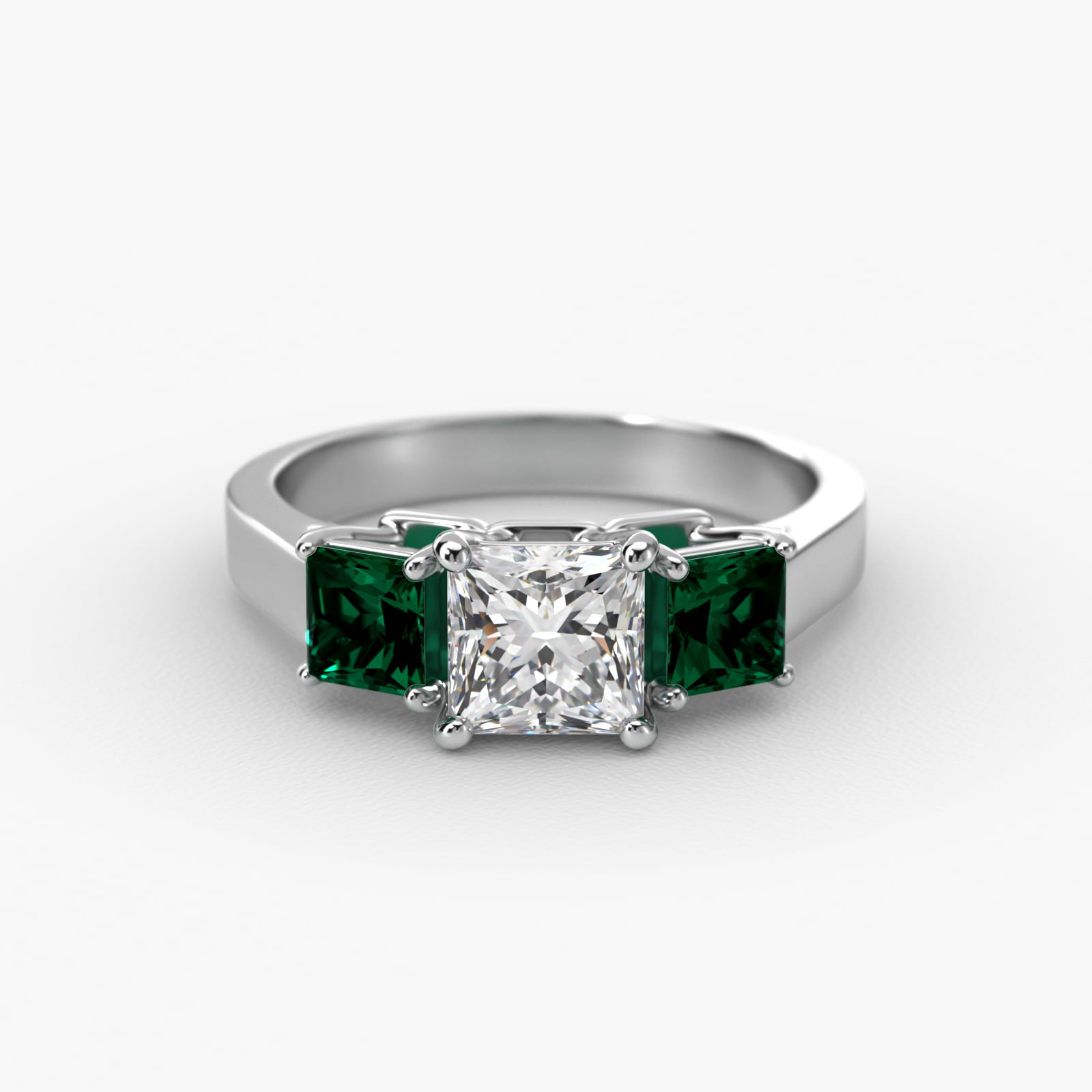 Step-Cut Emerald Three Stone Engagement Ring In 18K White Gold