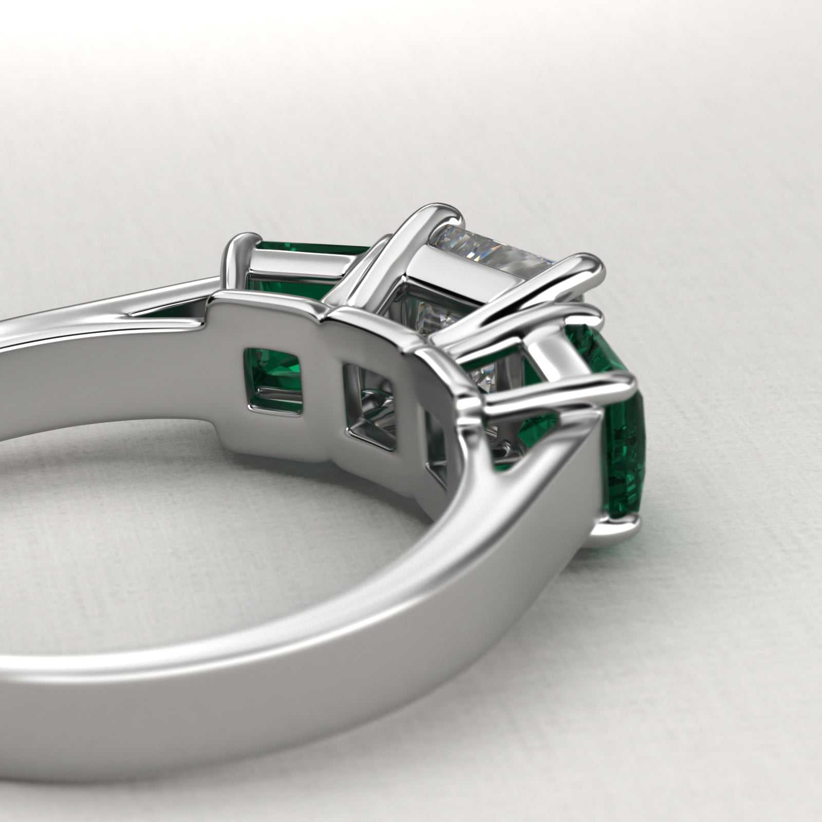 Step-Cut Emerald Three Stone Engagement Ring In 18K White Gold