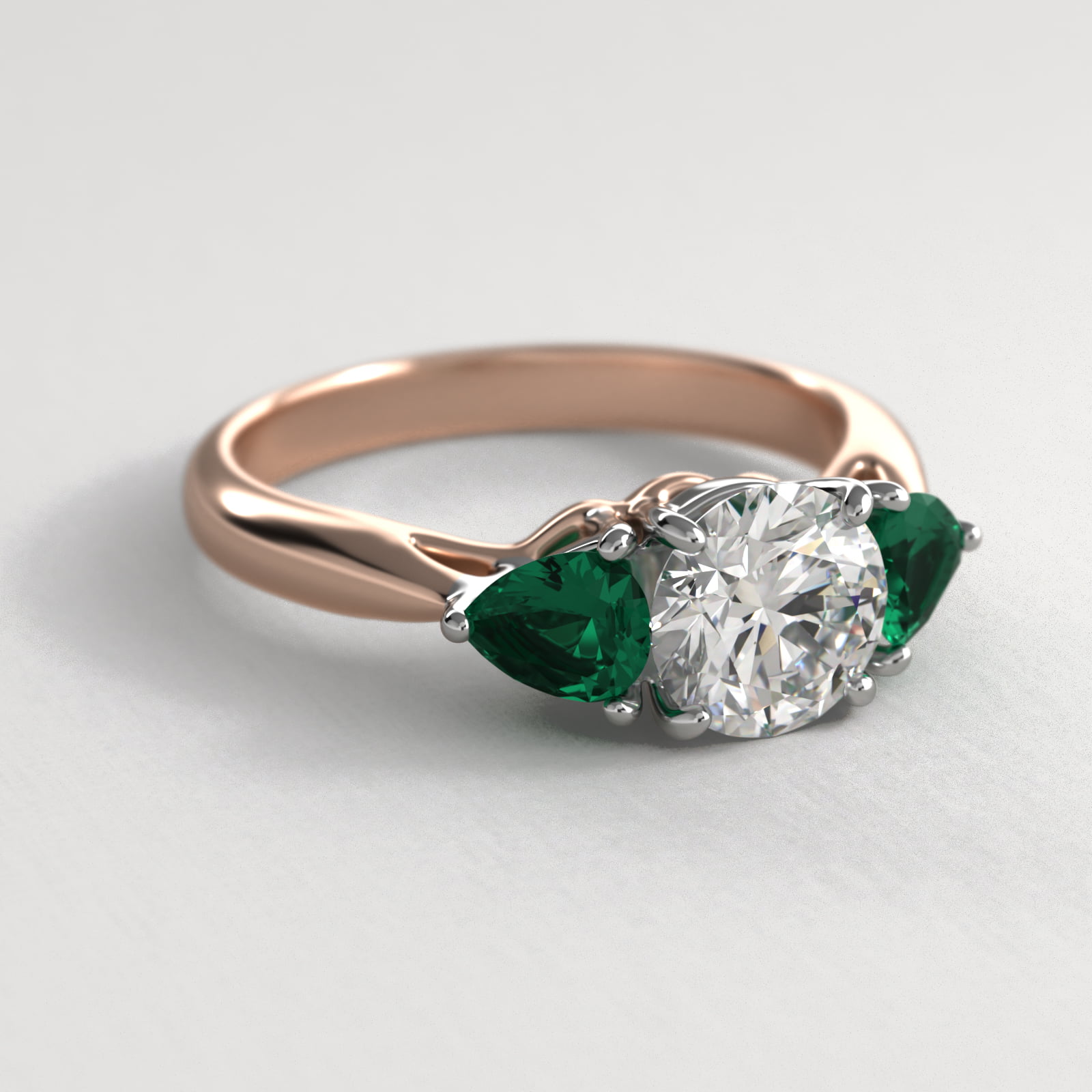 Pear Shaped Emerald Three Stone Engagement Ring In 14K Rose Gold