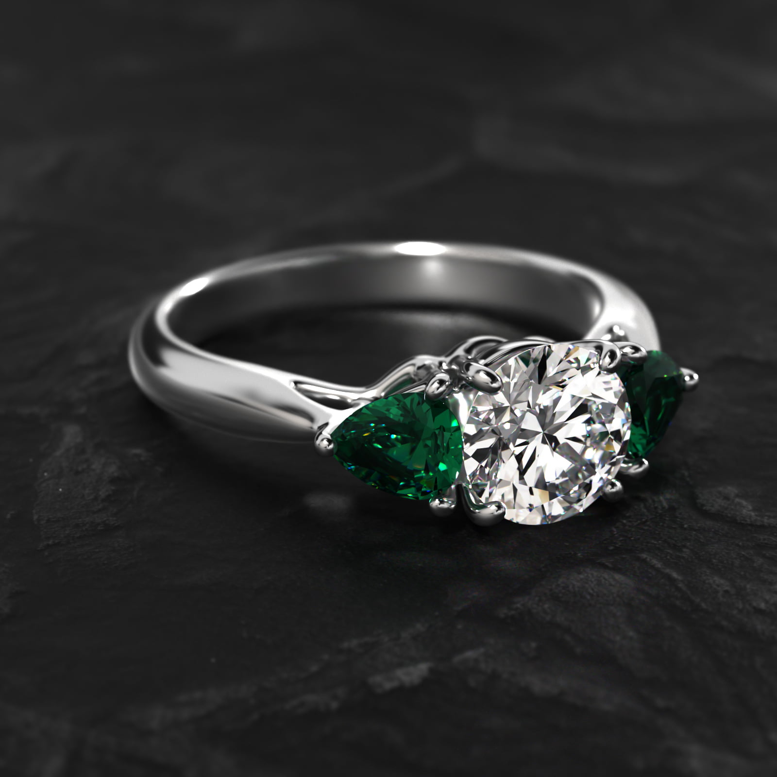 Pear Shaped Emerald Three Stone Engagement Ring In 18K White Gold