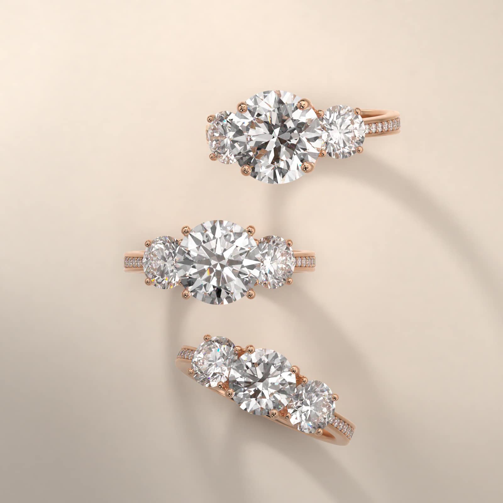 Round Diamond Three Stone Engagement Ring With Pavé Set Diamonds In 14K Rose Gold