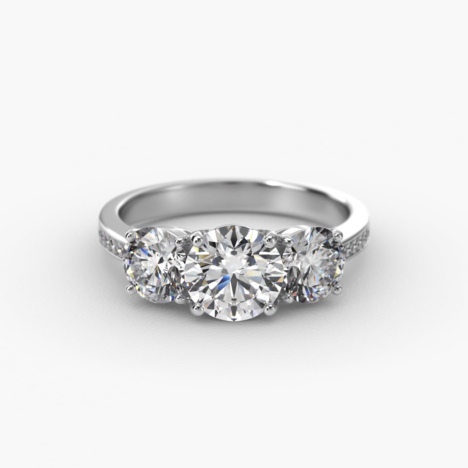 Round Diamond Three Stone Engagement Ring With Pavé Set Diamonds In Platinum