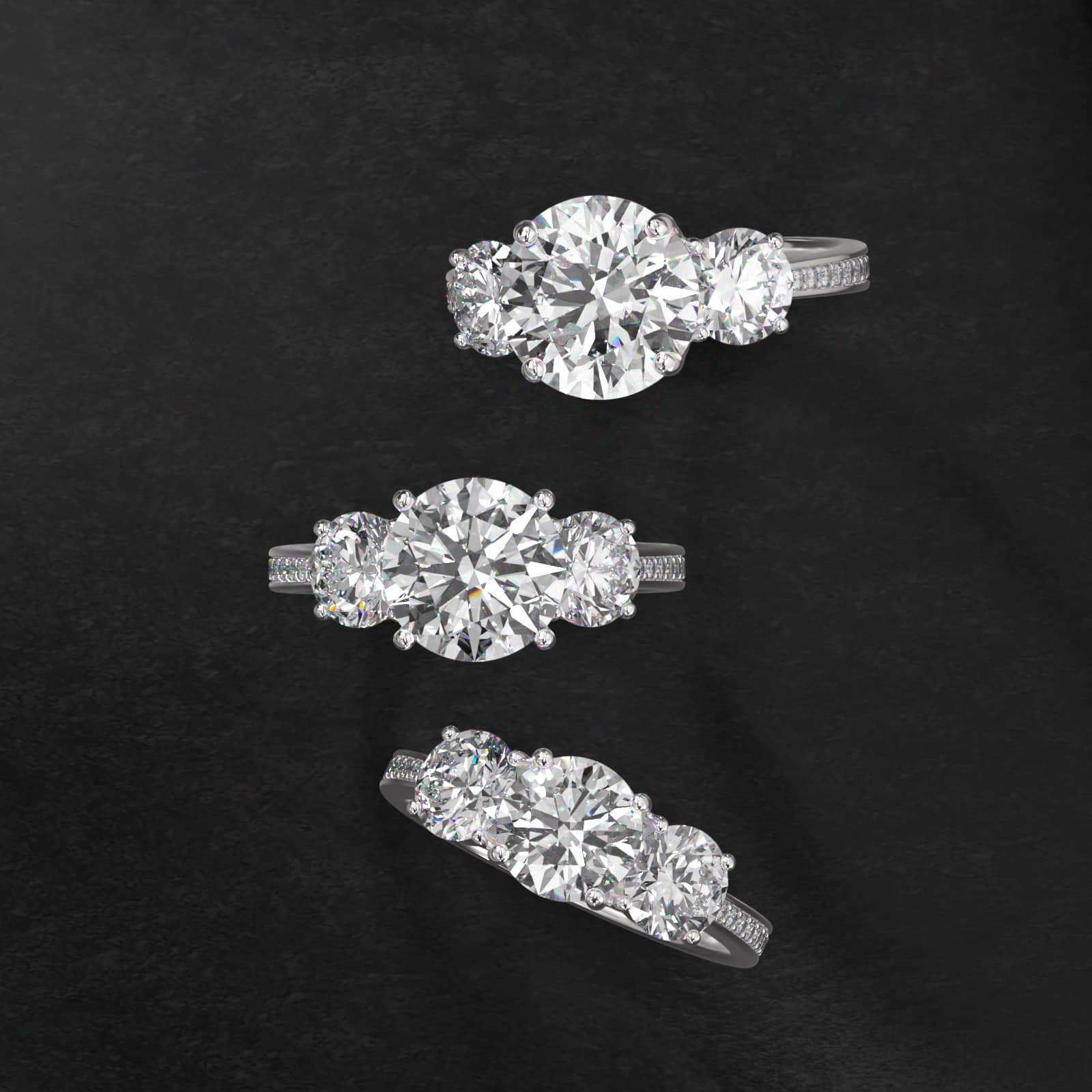 Round Diamond Three Stone Engagement Ring With Pavé Set Diamonds In 18K White Gold