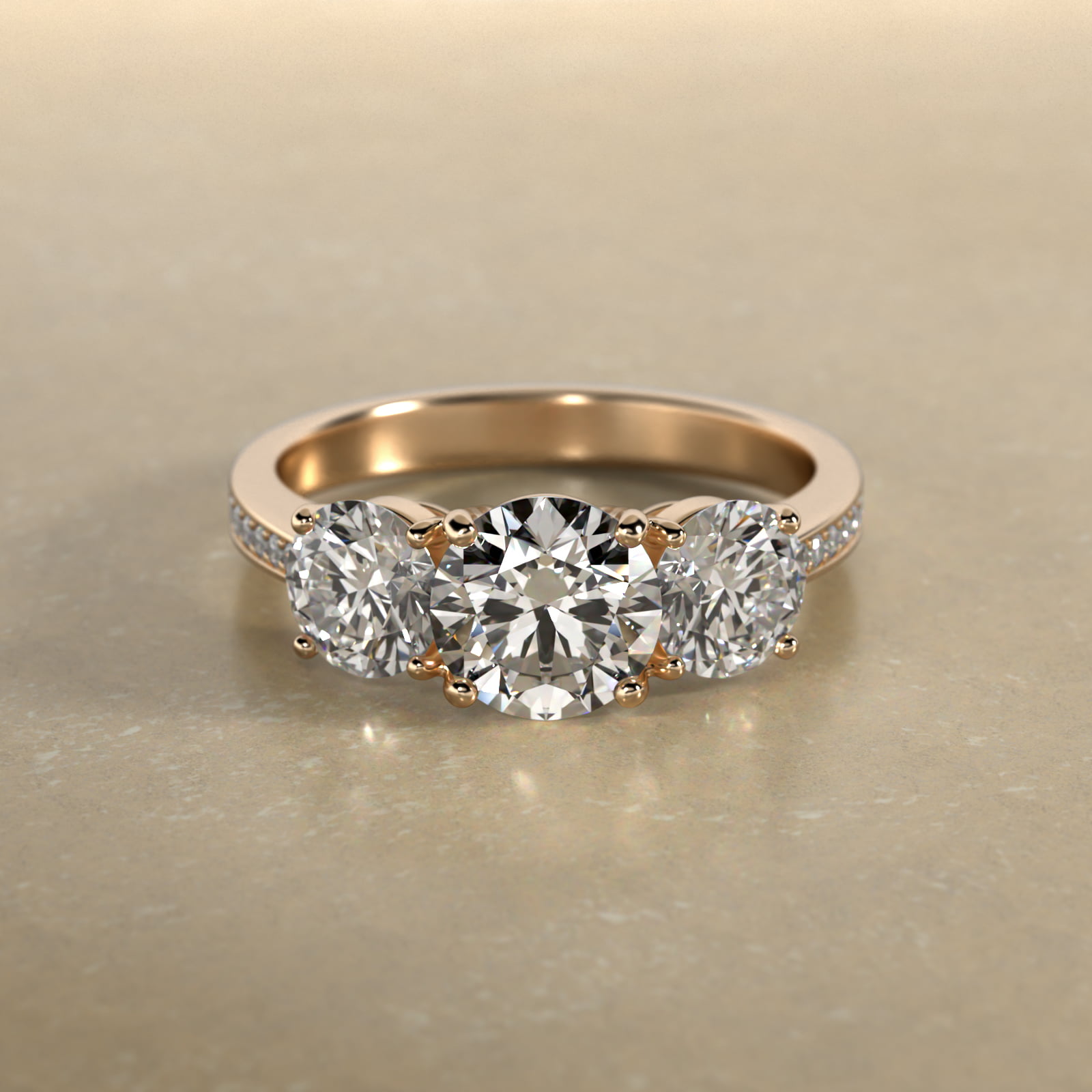 Round Diamond Three Stone Engagement Ring With Pavé Set Diamonds In 18K Yellow Gold
