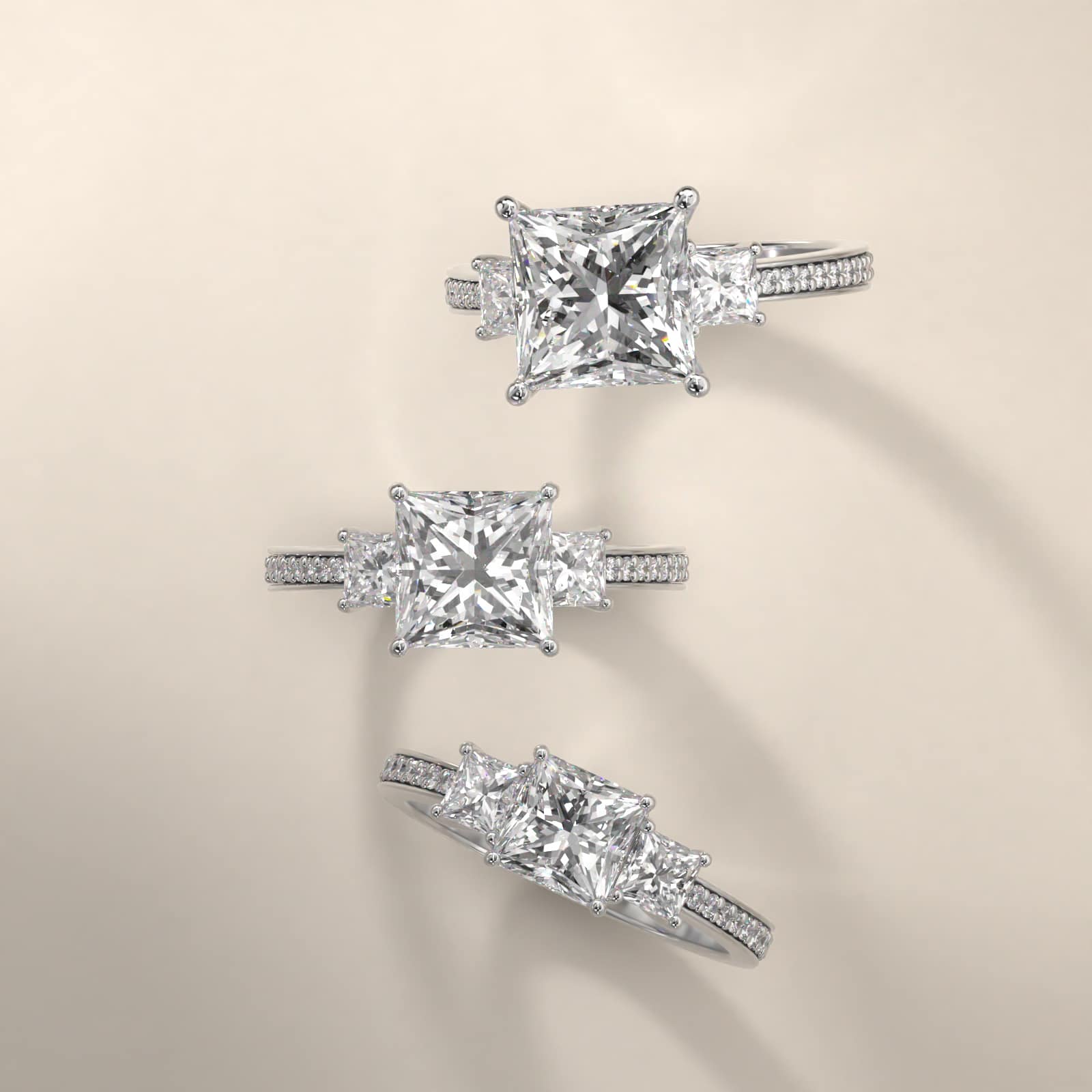 Princess Cut Diamond Three Stone Engagement Ring With Pavé Set Diamonds In 18K White Gold