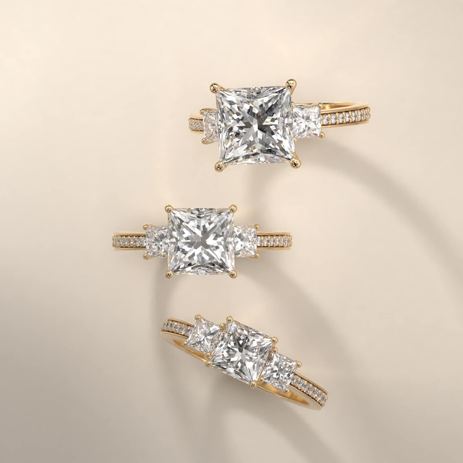 Princess Cut Diamond Three Stone Engagement Ring With Pavé Set Diamonds In 18K Yellow Gold