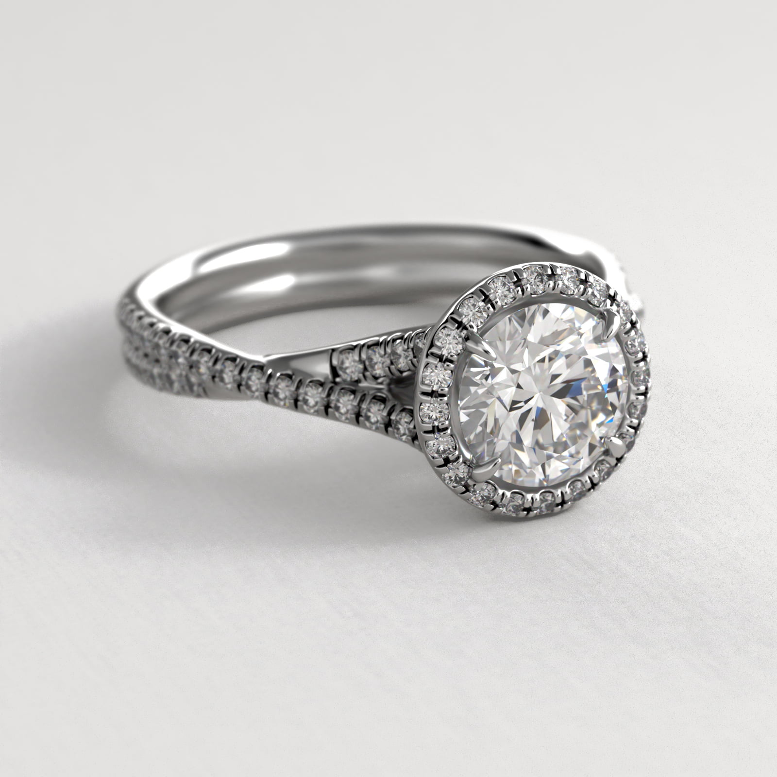 Platinum Pavé Halo and Twisted Shank Diamond Engagement Ring