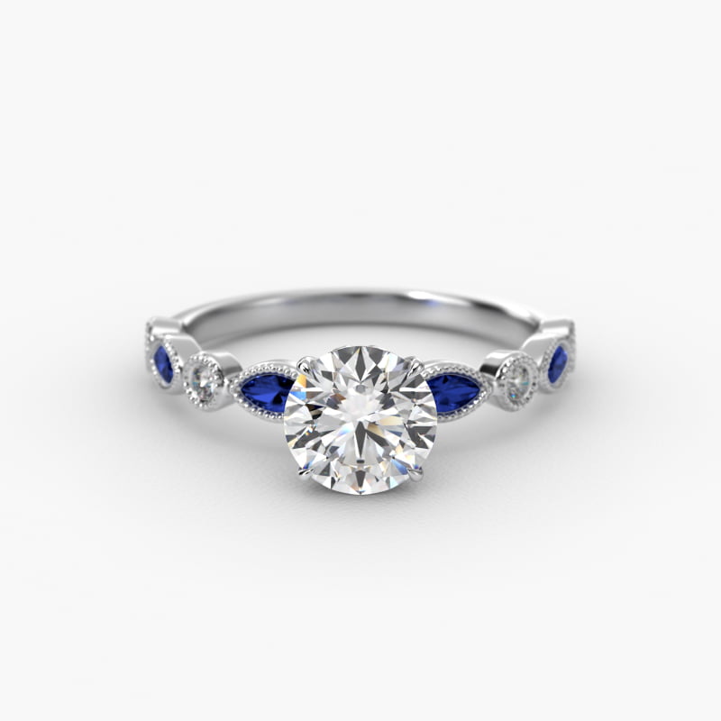 Vintage Round Diamond and Marquise Sapphire Side Stone Engagement Ring In Platinum