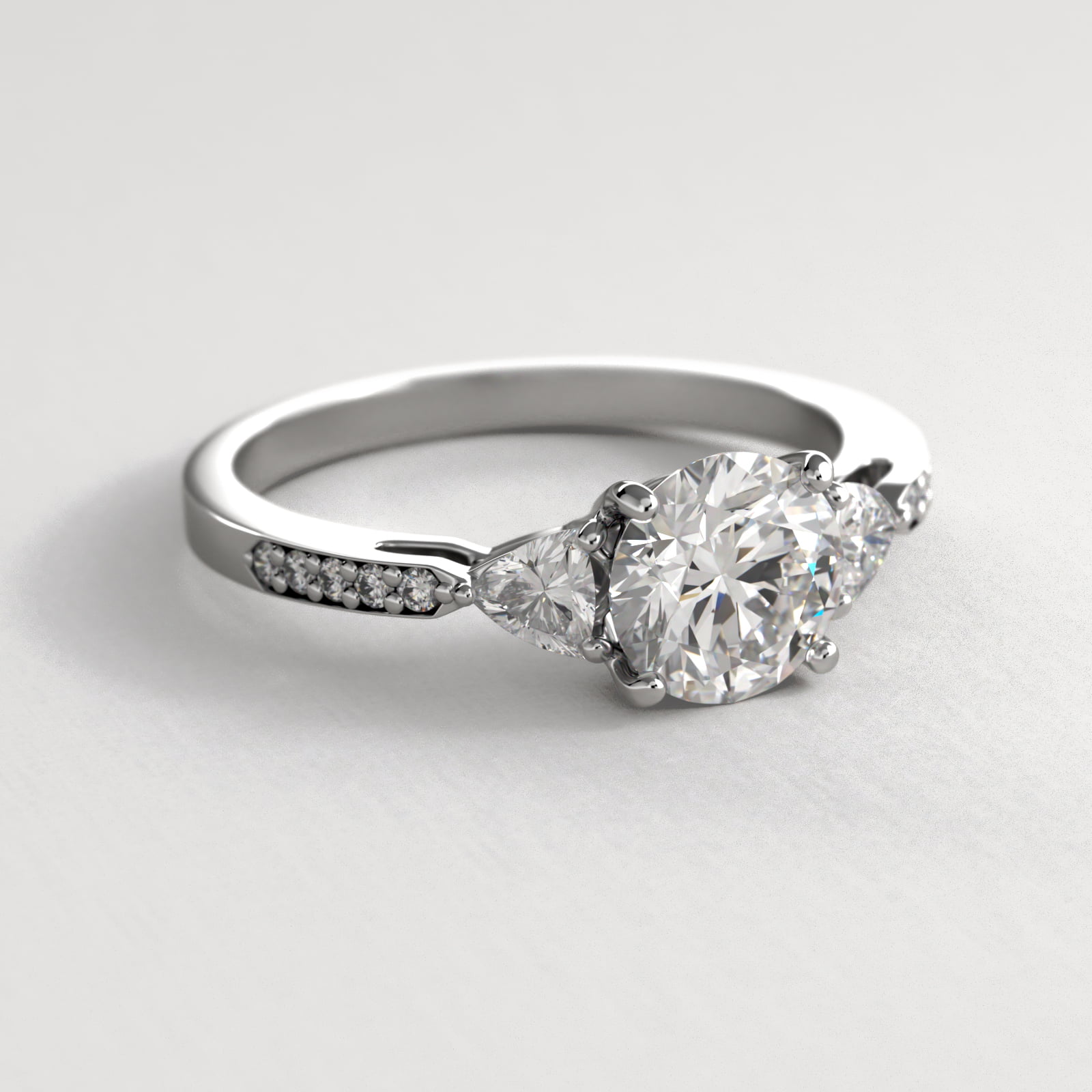 Trillion Cut Diamond Three Stone Engagement Ring With Pavé Set Diamonds In 14K White Gold