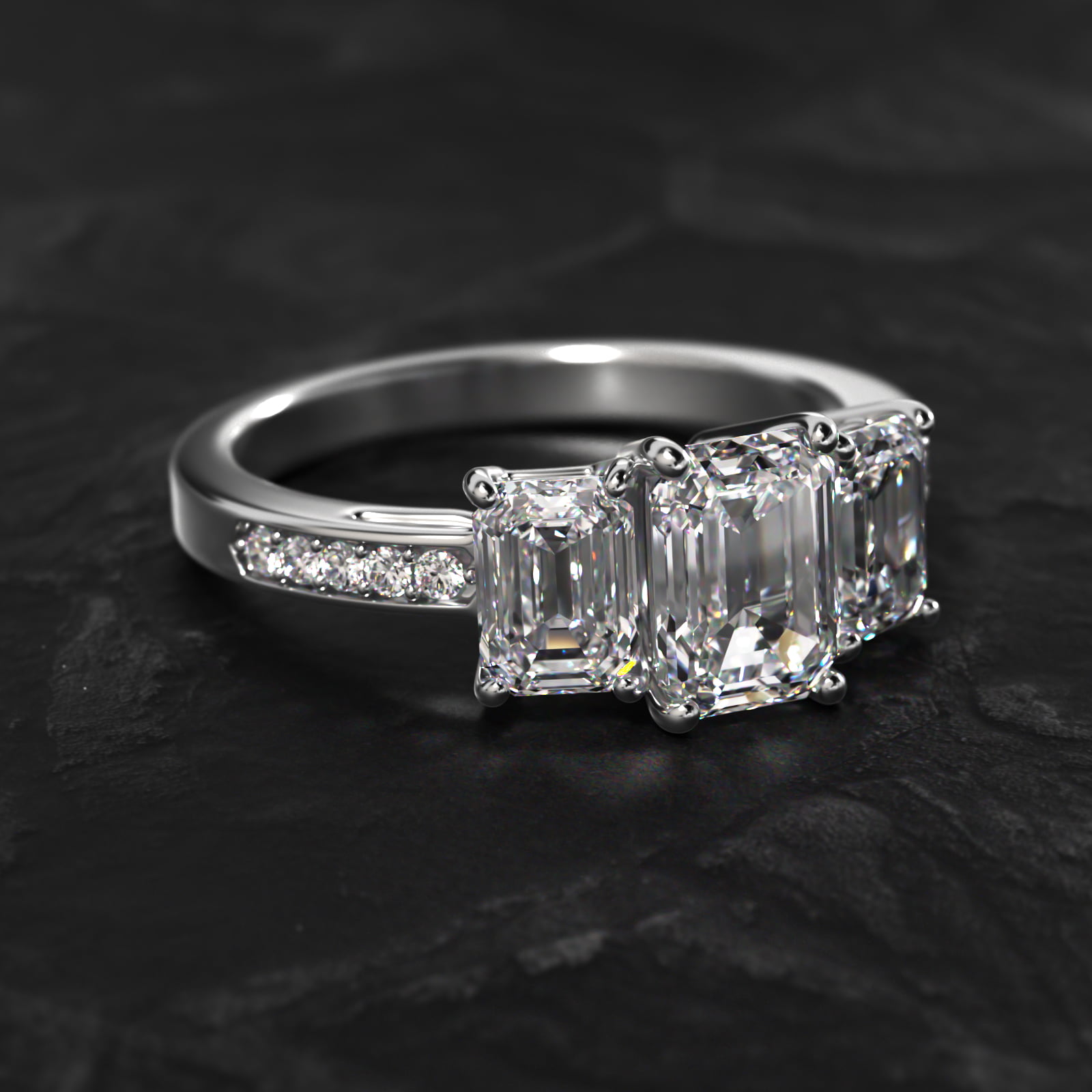 Emerald Cut Diamond Three Stone Engagement Ring With Pavé Set Diamonds In 14K White Gold