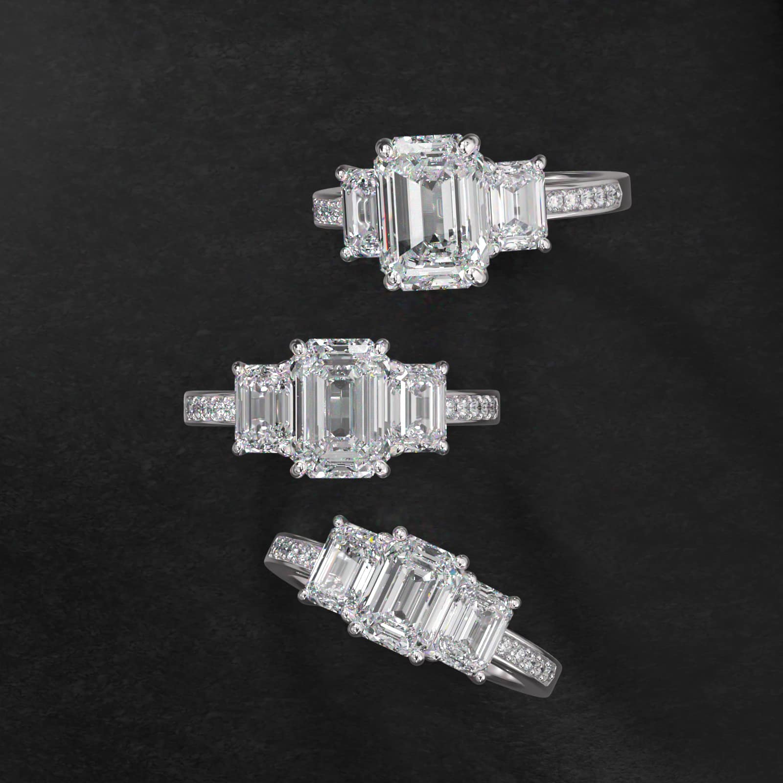 Emerald Cut Diamond Three Stone Engagement Ring With Pavé Set Diamonds In Platinum
