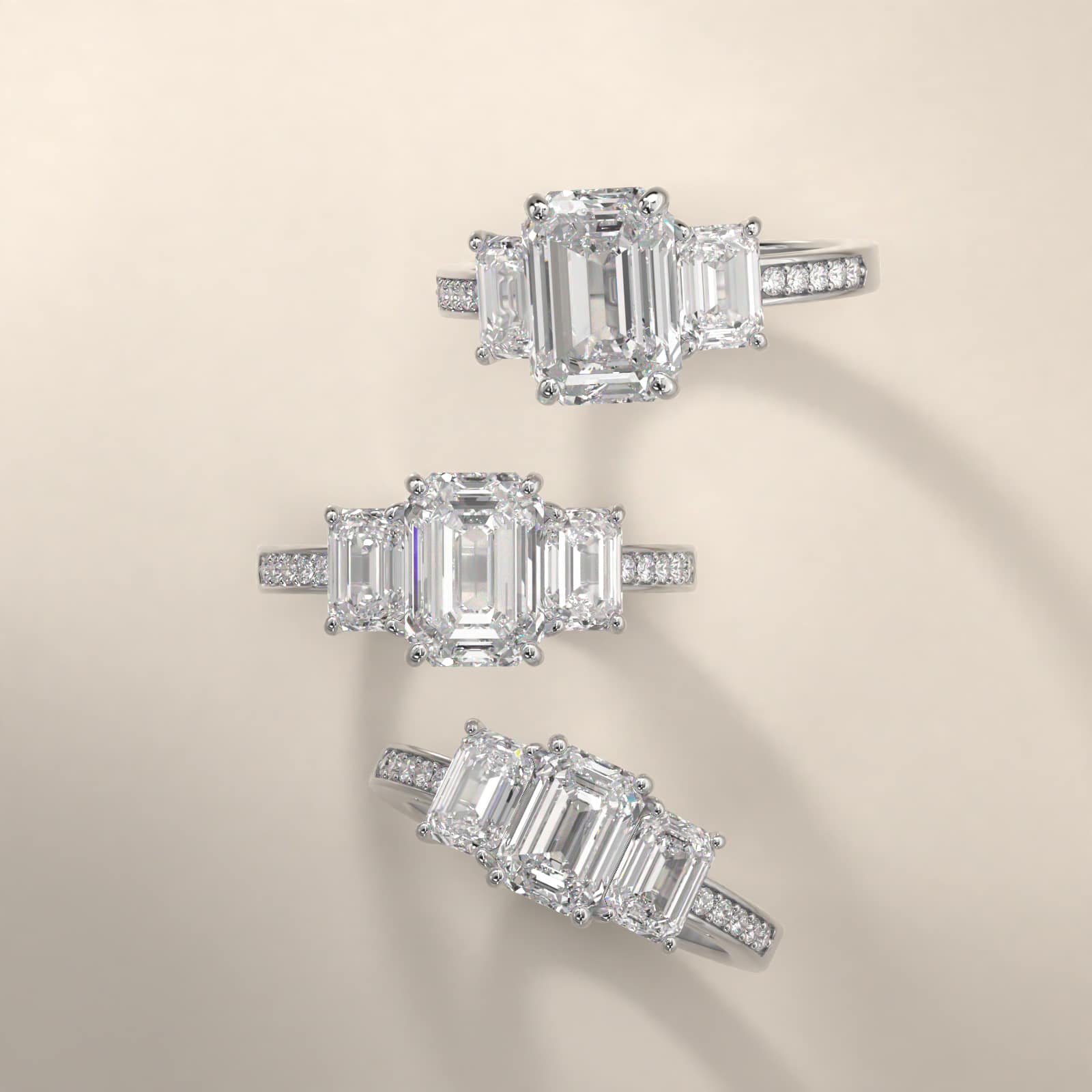 Emerald Cut Diamond Three Stone Engagement Ring With Pavé Set Diamonds In 14K White Gold