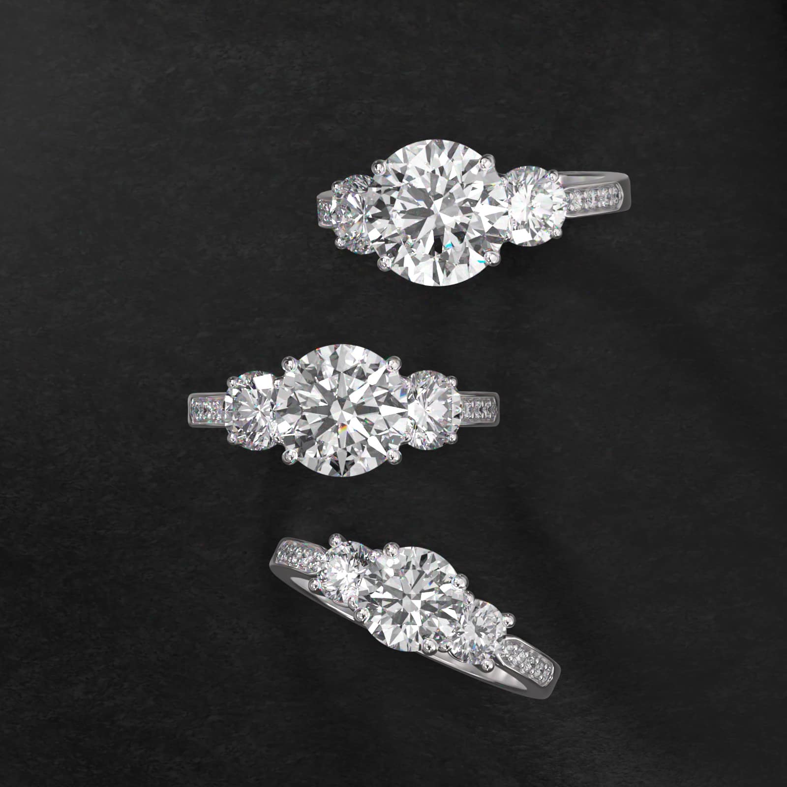 Round Diamond Three Stone Engagement Ring With Pavé Set Diamonds In Platinum