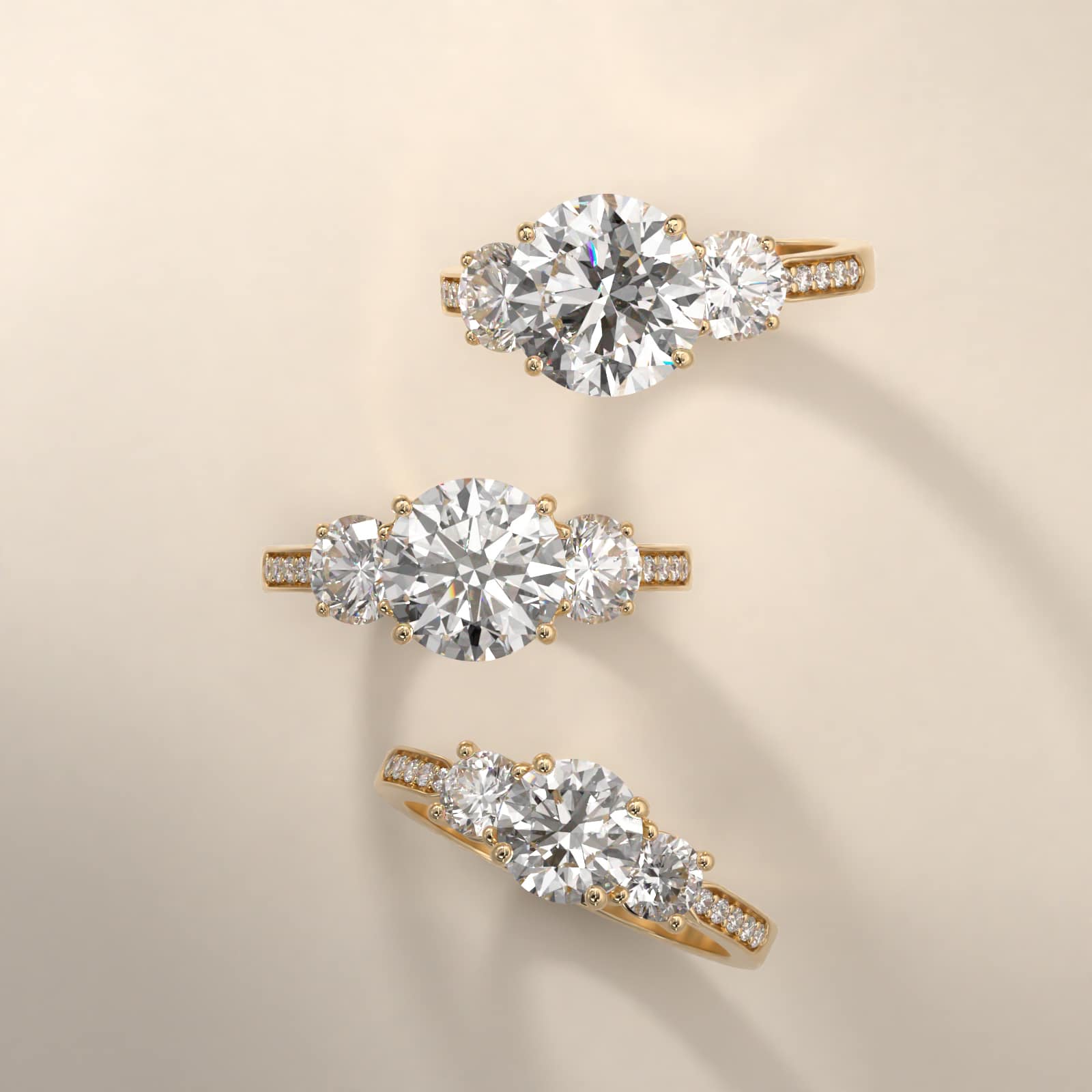 Round Diamond Three Stone Engagement Ring With Pavé Set Diamonds In 14K Yellow Gold