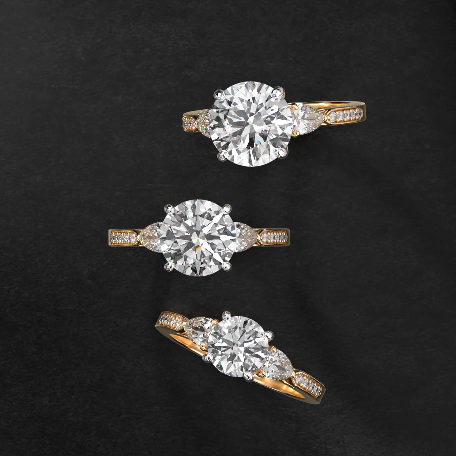 Pear Shaped Diamond Three Stone Engagement Ring With Pavé Set Diamonds In 18K Yellow Gold