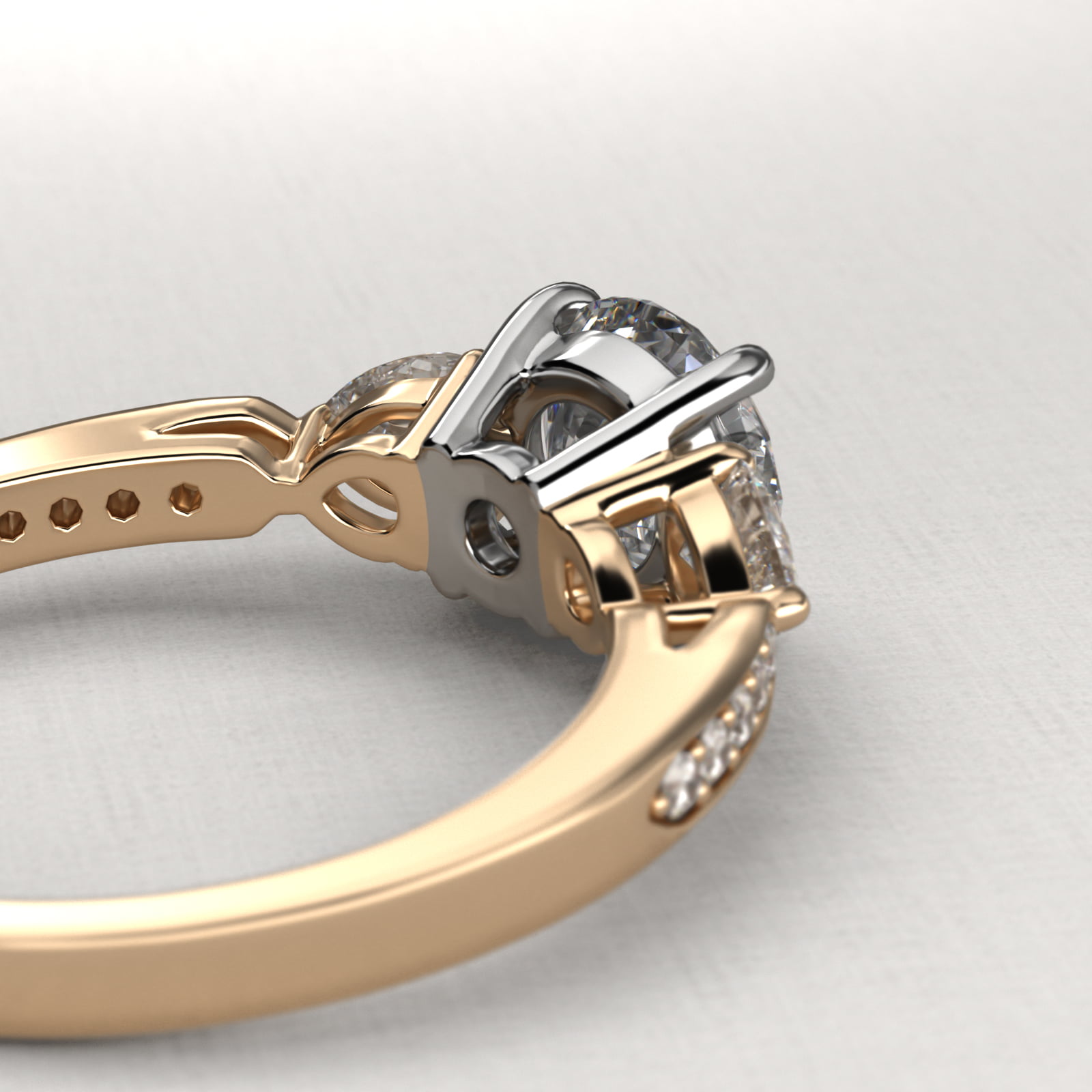 Pear Shaped Diamond Three Stone Engagement Ring With Pavé Set Diamonds In 18K Yellow Gold