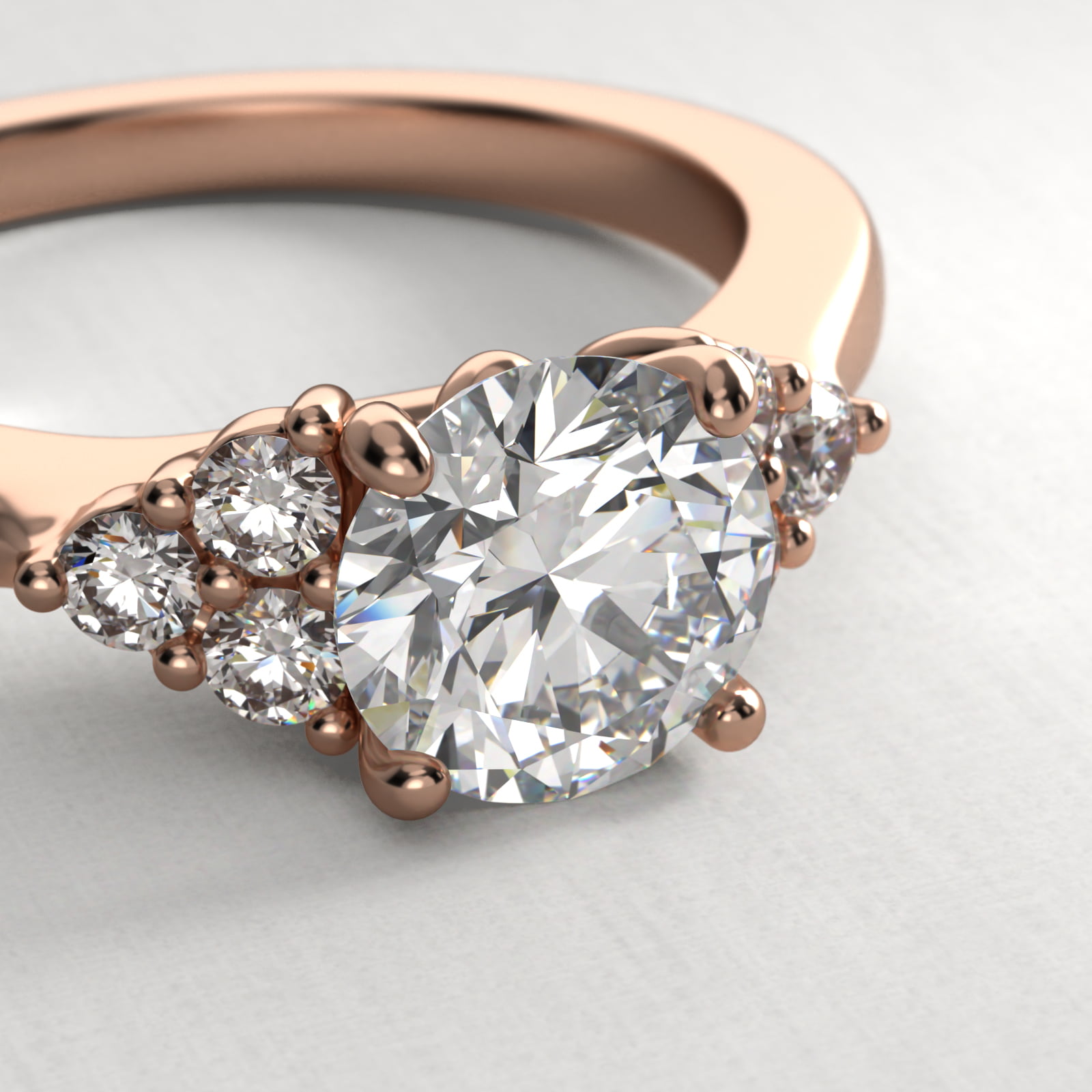 Triple Side Stone Diamond Engagement Ring In 14K Rose Gold