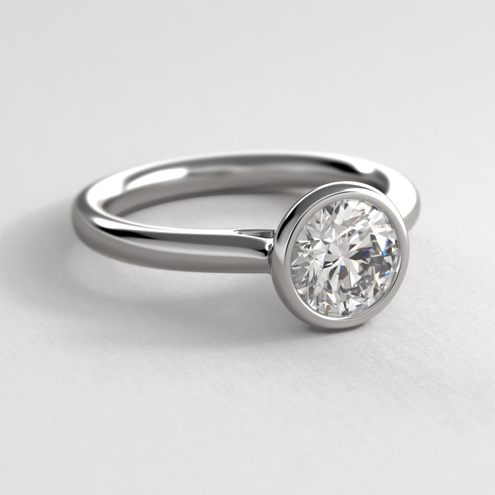 Bezel Set Solitaire Engagement Ring In Platinum