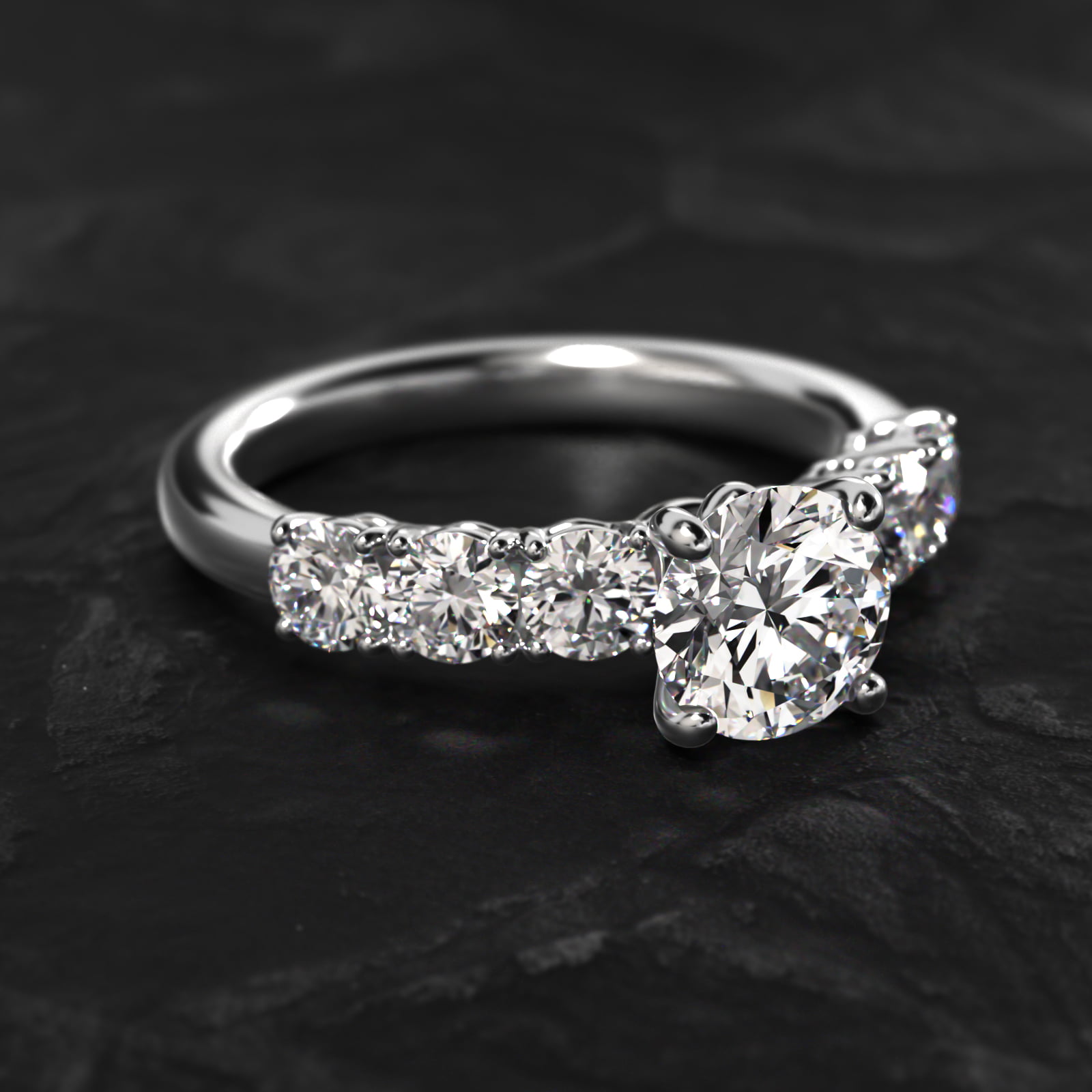 Prong Set Side Stone Diamond Engagement Ring In Platinum