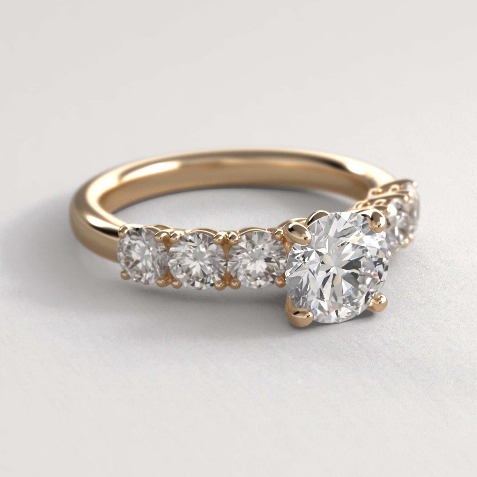 Prong Set Side Stone Diamond Engagement Ring In 18K Yellow Gold