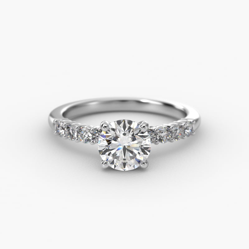 Prong Set Side Stone Diamond Engagement Ring In Platinum