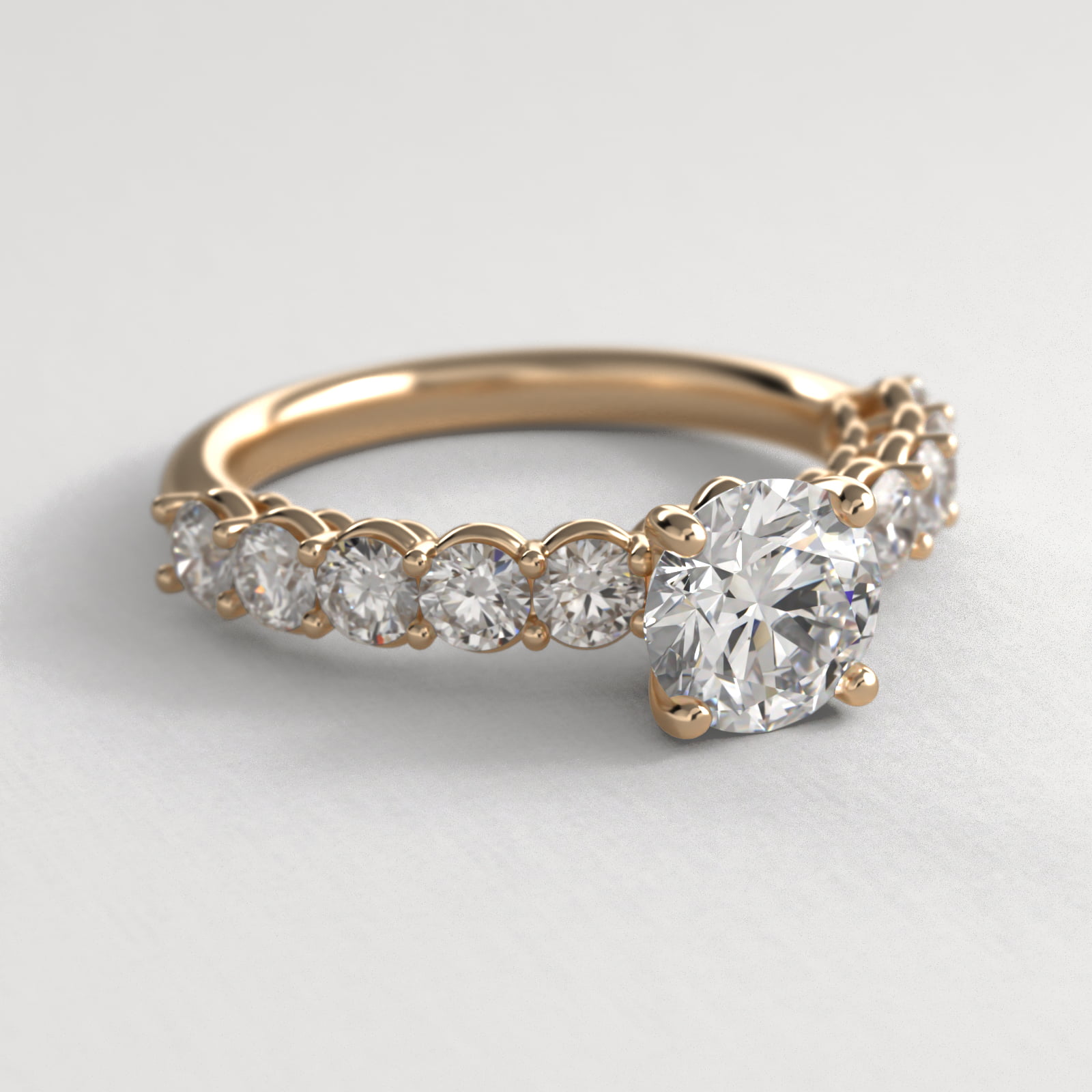 Prong Set Side Stone Diamond Engagement Ring In 14K Yellow Gold
