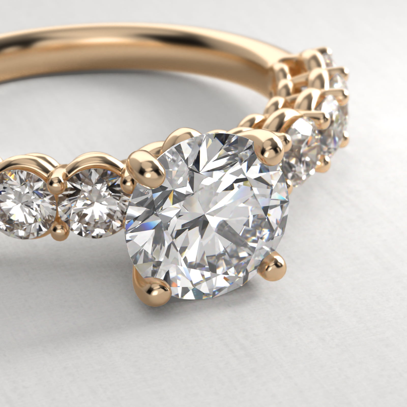 Prong Set Side Stone Diamond Engagement Ring In 14K Yellow Gold