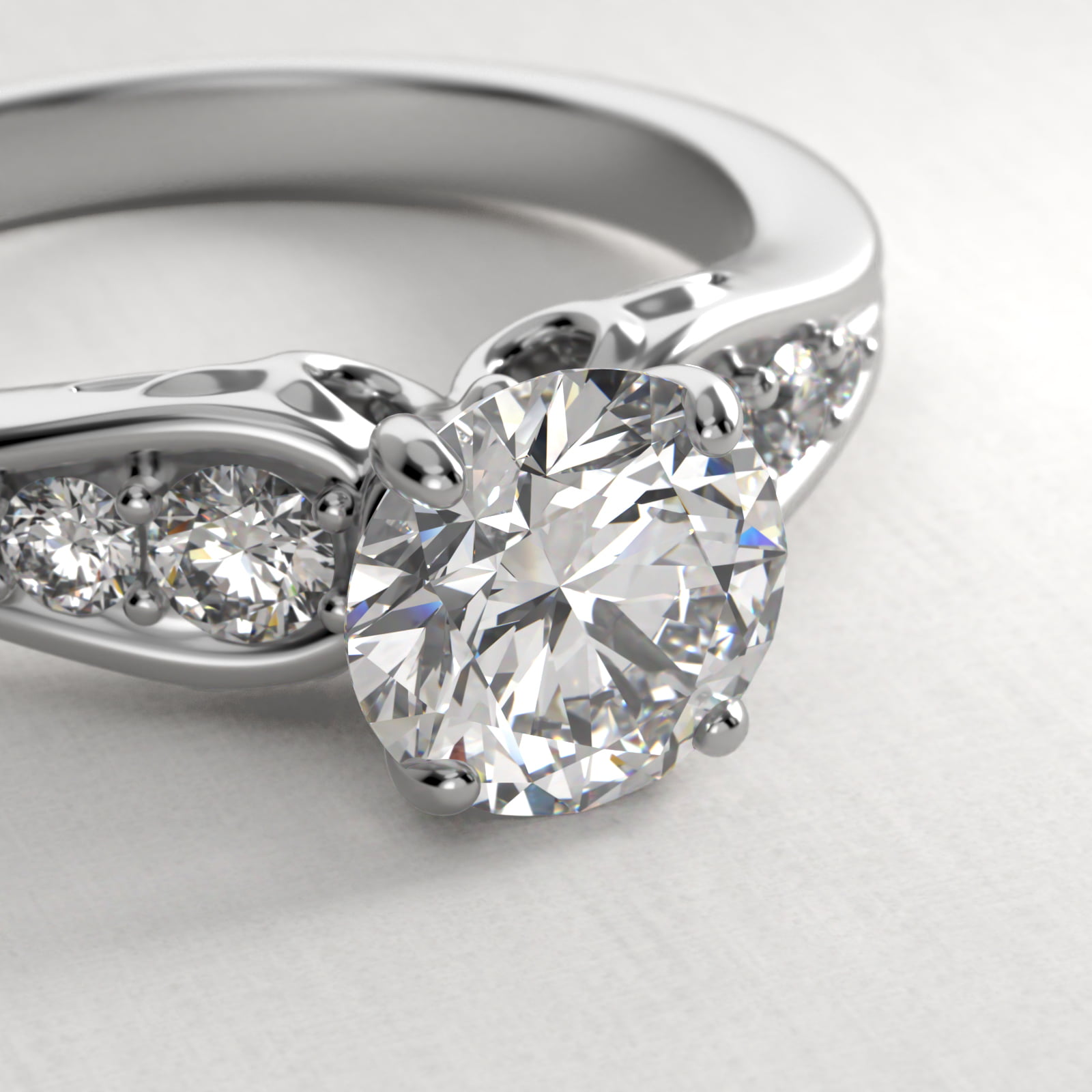 Graduated Pavé Swirl Side Stone Diamond Engagement Ring In Platinum