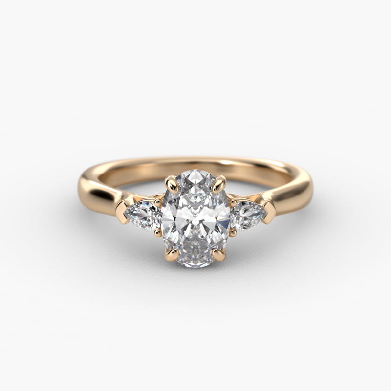 Pear Shaped Diamond Three Stone Engagement Ring In 14K Yellow Gold