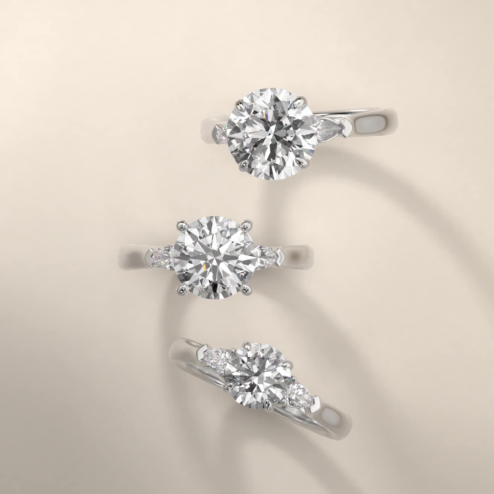 Pear Shaped Diamond Three Stone Engagement Ring In Platinum