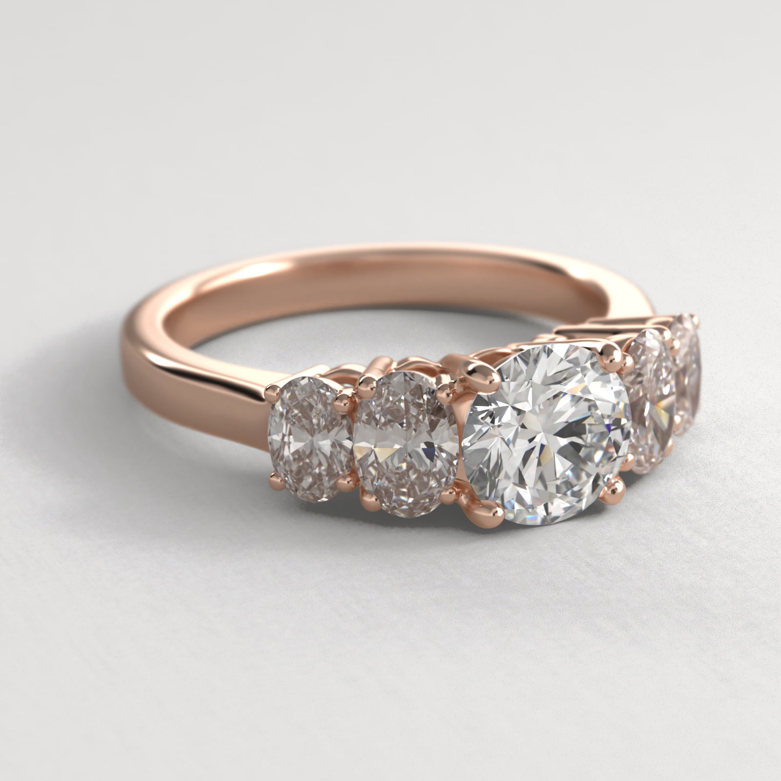 Four Oval Cut Side Stone Diamond Engagement Ring In 14K Rose Gold