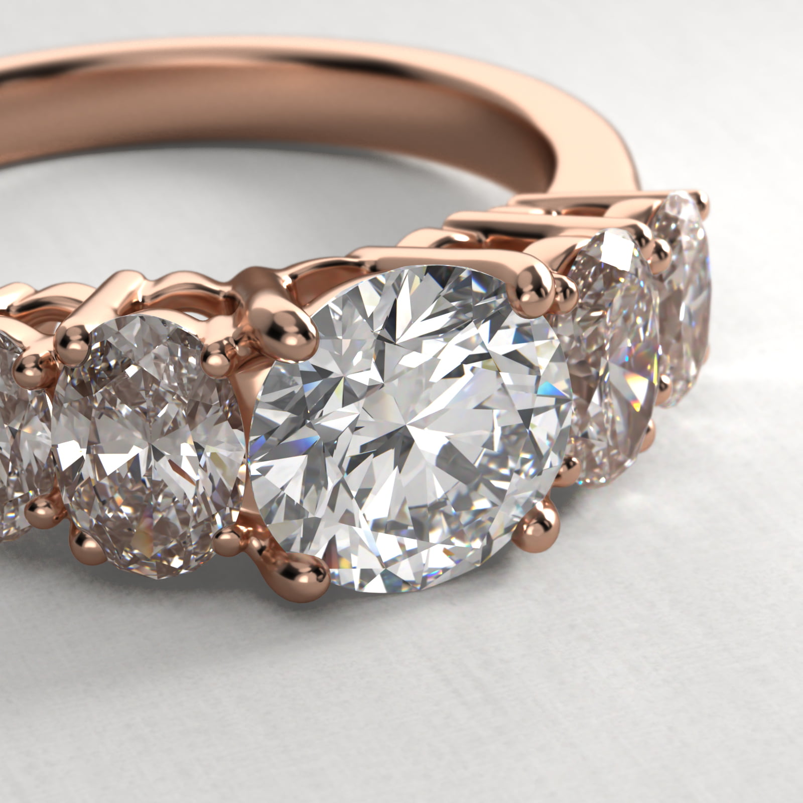 Four Oval Cut Side Stone Diamond Engagement Ring In 14K Rose Gold