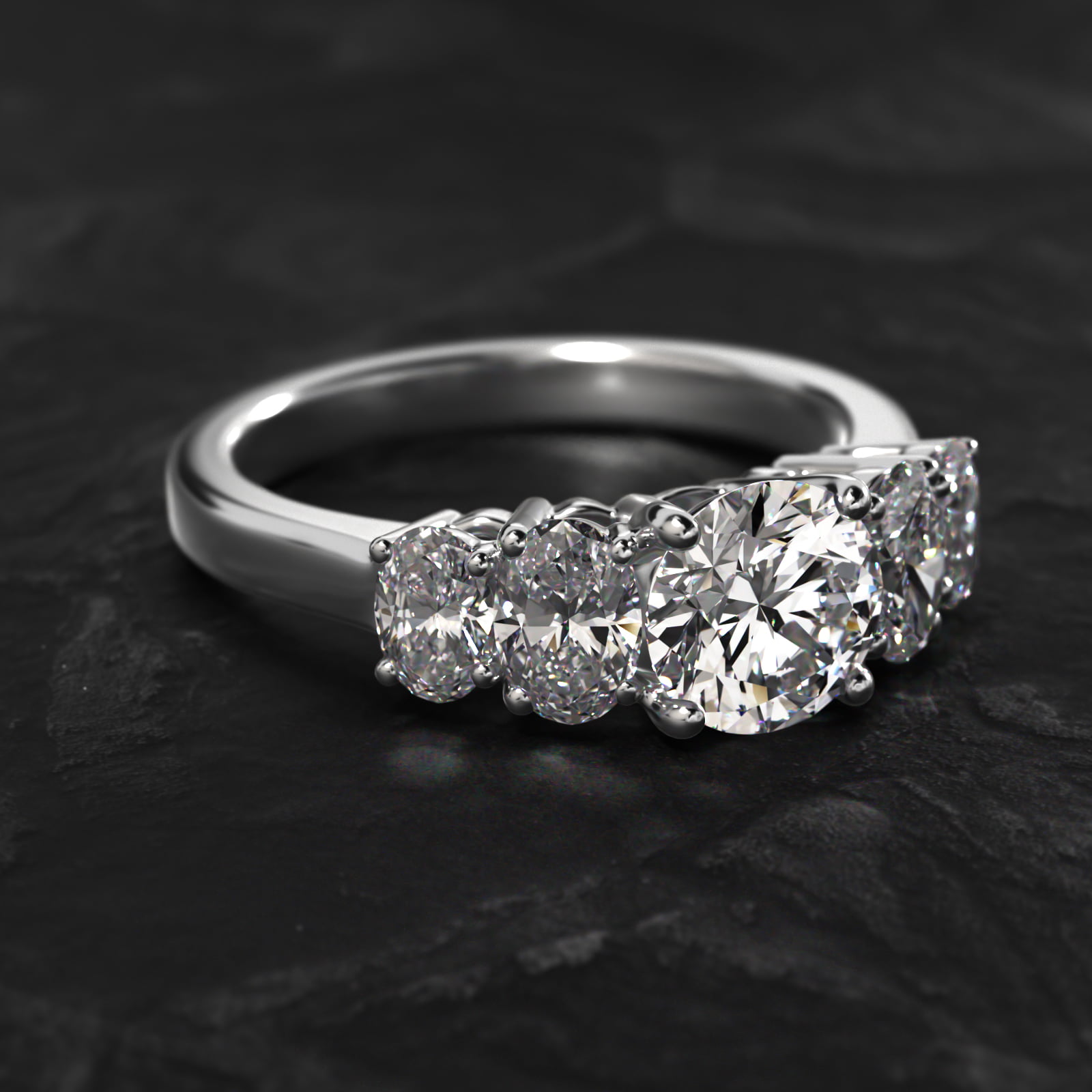 Four Oval Cut Side Stone Diamond Engagement Ring In Platinum