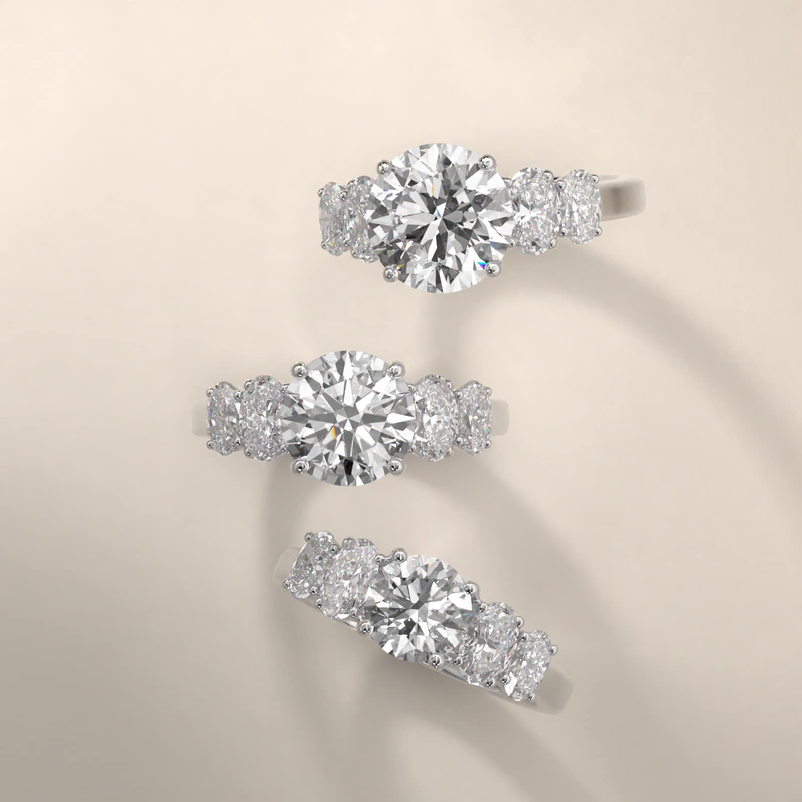 Four Oval Cut Side Stone Diamond Engagement Ring In 18K White Gold