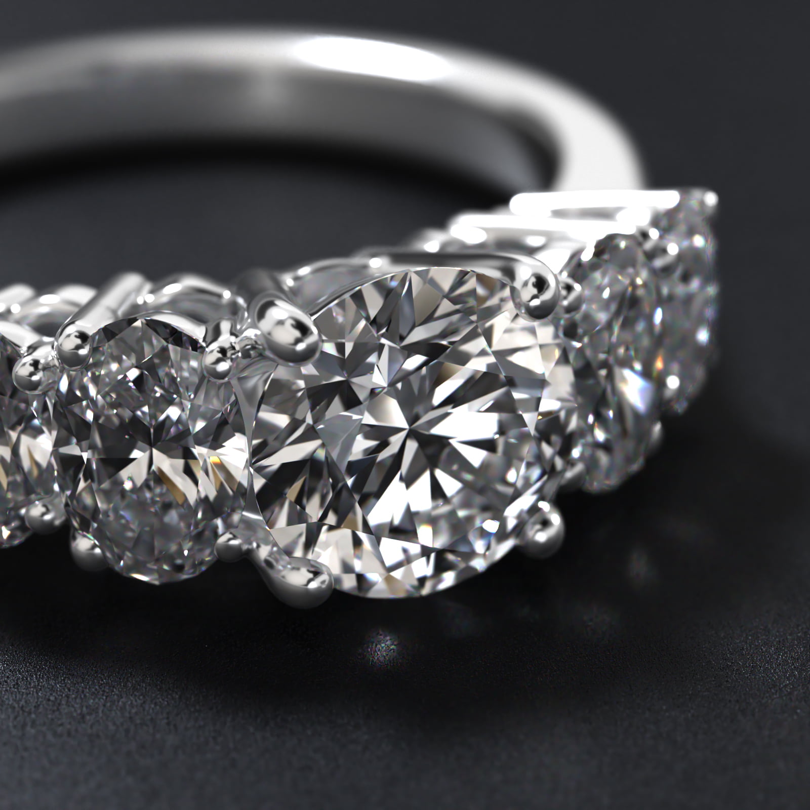 Four Oval Cut Side Stone Diamond Engagement Ring In 18K White Gold