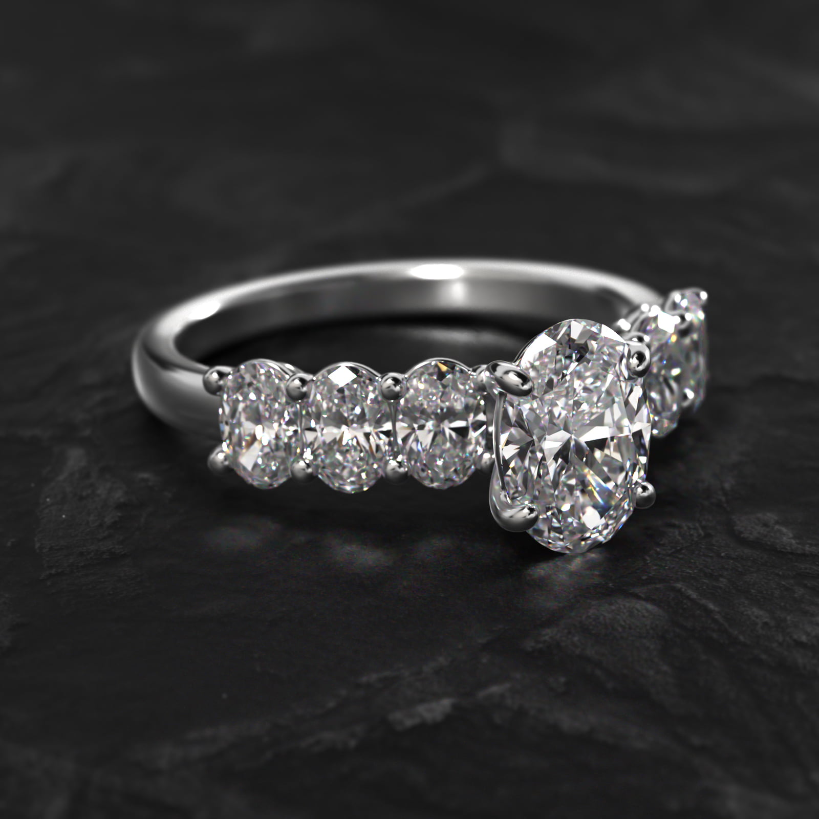 Oval Cut Side Stone Diamond Engagement Ring In Platinum